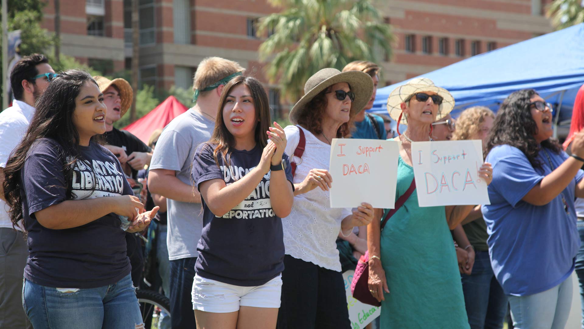 Perla Rojas (left) and Ana Mendoza (center) were among the DACA recipients who gathered on the University of Arizona mall Tuesday afternoon.