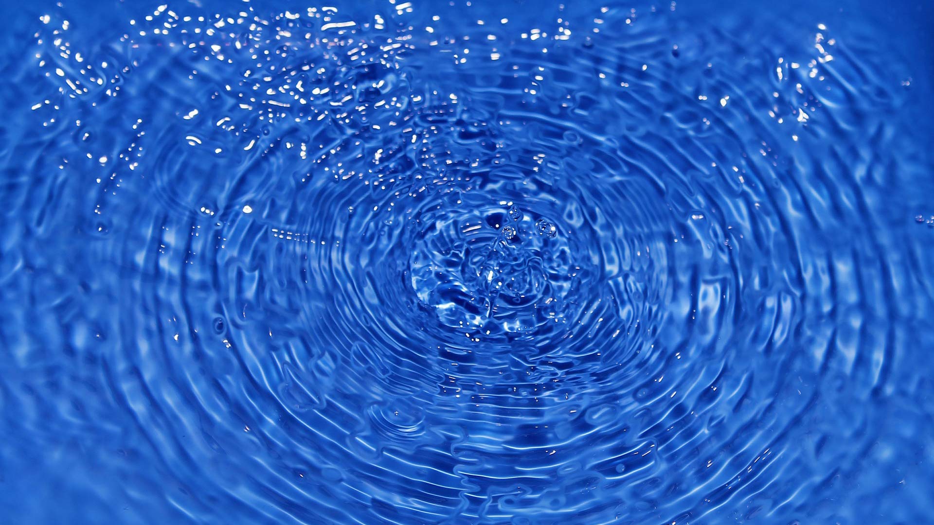 Drops and ripples in water.