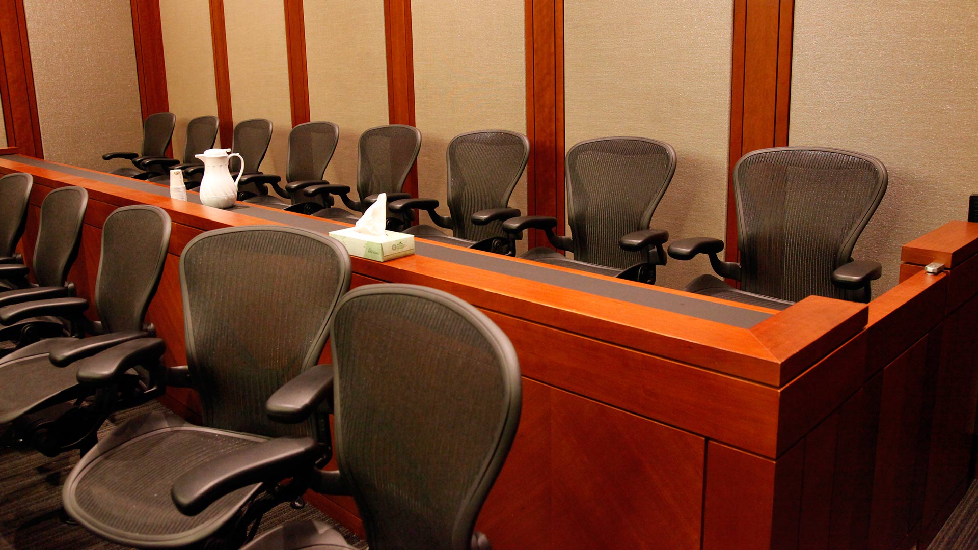 Empty seats await their jurors.