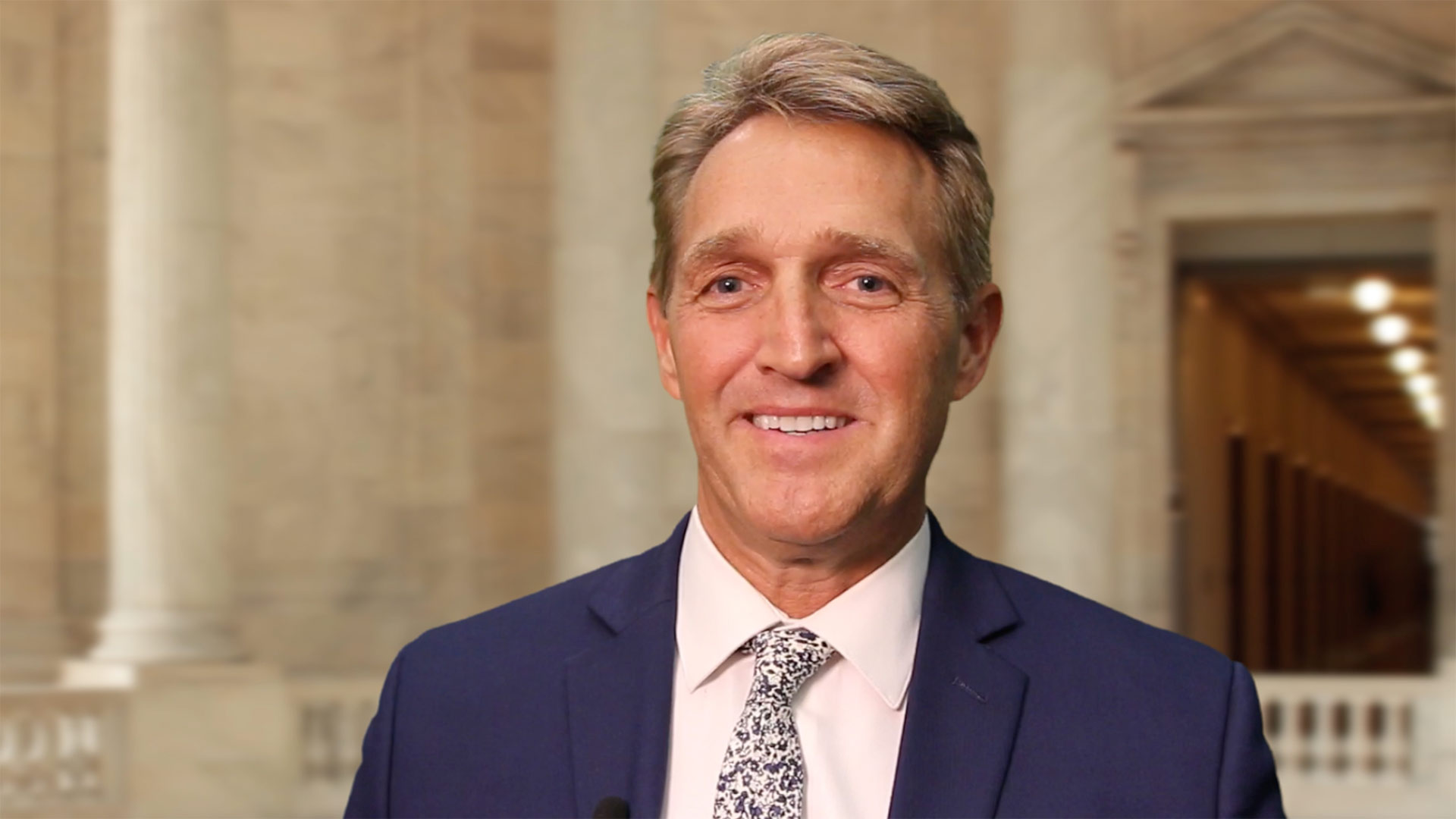 Sen. Jeff Flake talks with media members from Arizona about his decision to not run for re-election, Oct. 25, 2017.