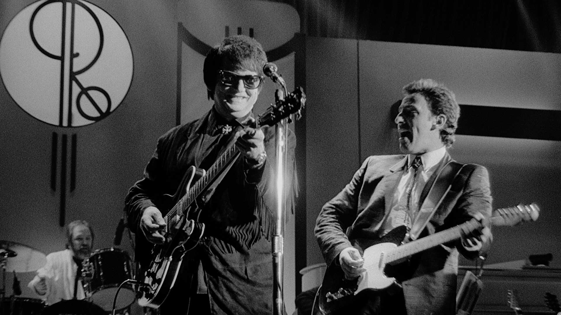 Roy Orbison and Bruce Springsteen perform “Dream Baby.”