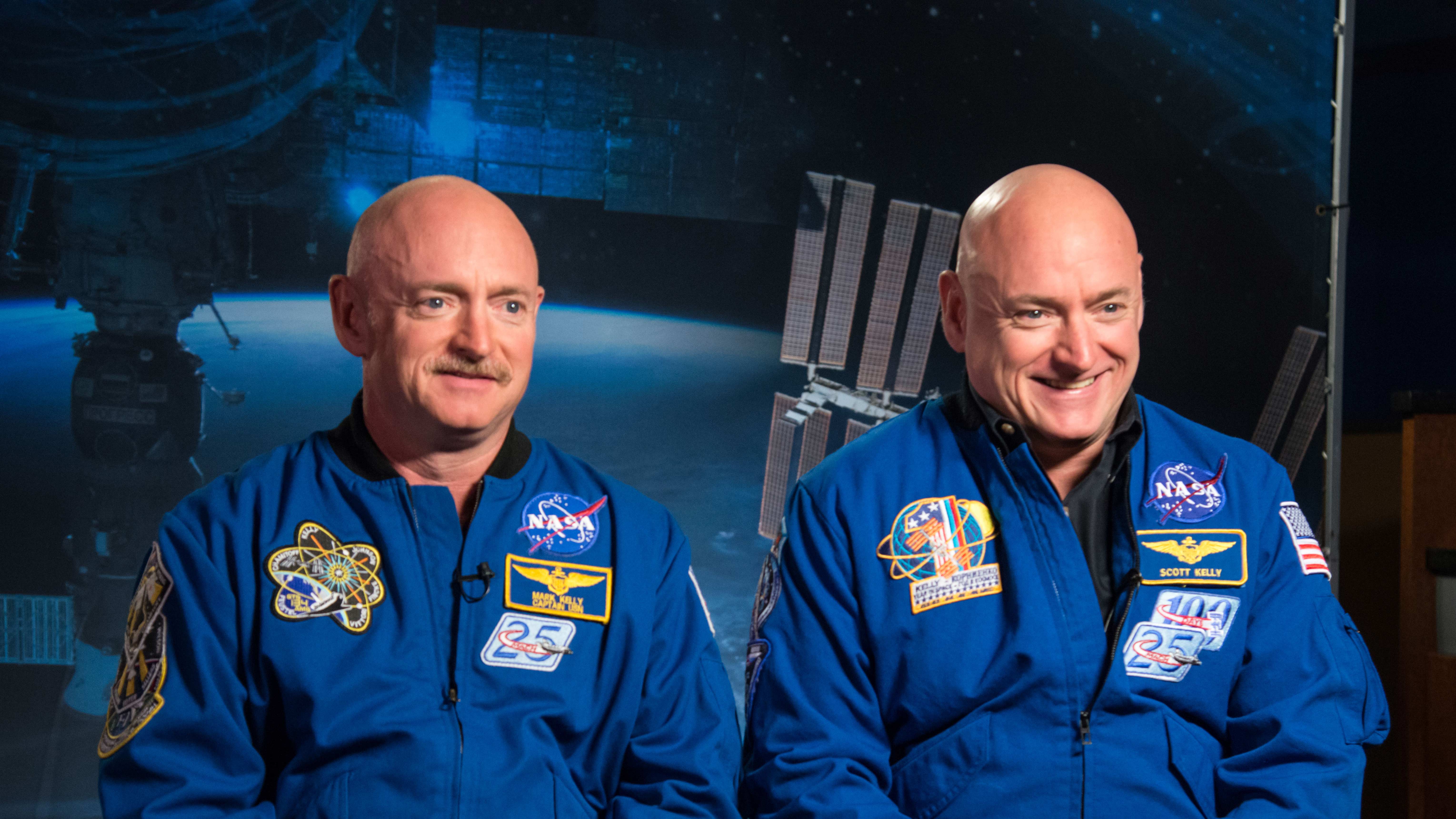 Expedition 45/46 Commander, retired astronaut Scott Kelly (right) along with his twin brother, retired astronaut Mark Kelly (left) speak to media about the Twins Study and One-Year Mission.