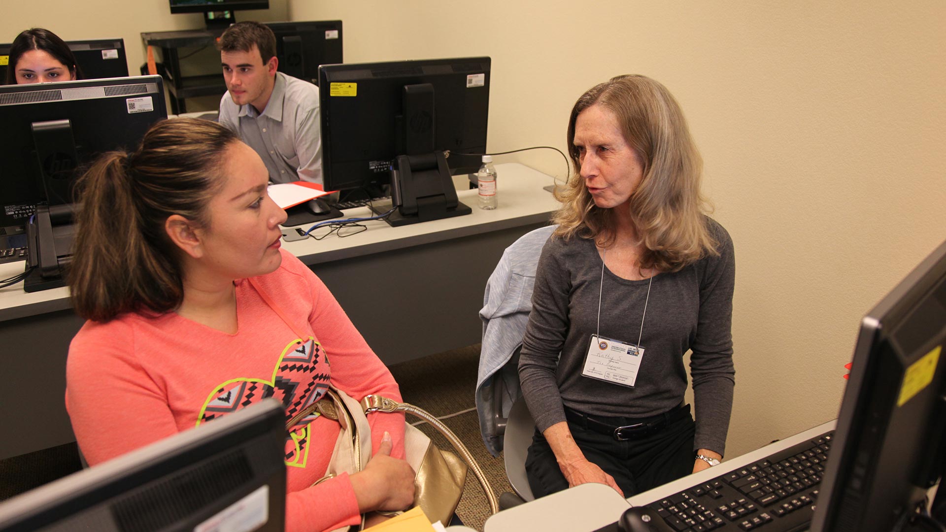 Volunteer tax preparer Katherine Steiner helps a taxpayer prepare her return. 