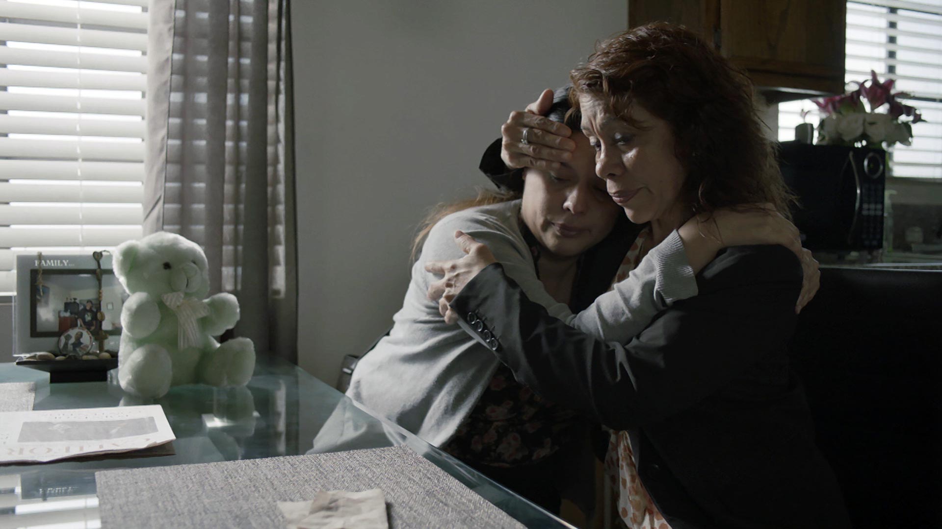 Leticia Moreno Gomez comforts her daughter Marissa Ramirez.