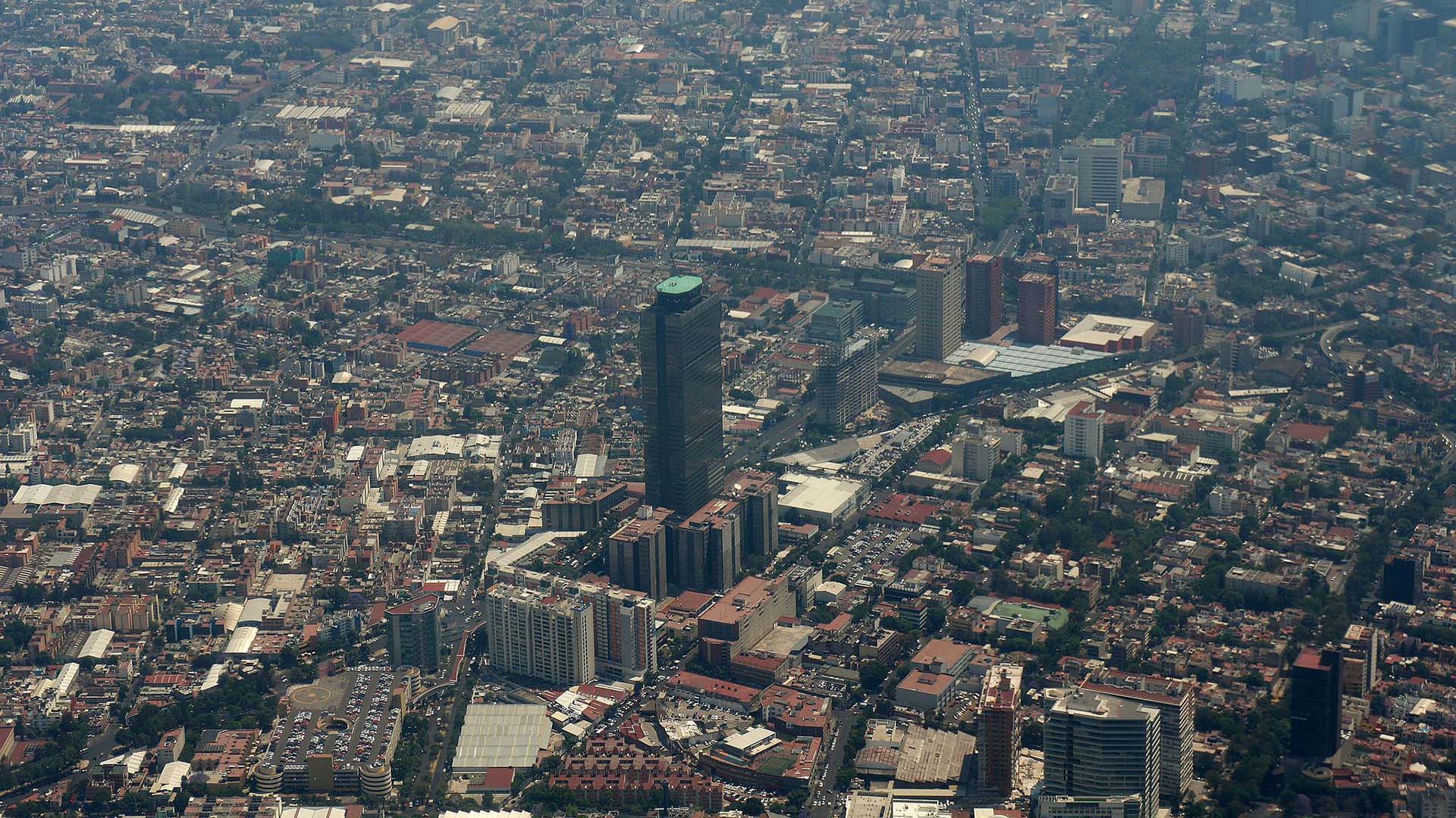 The Pemex Tower stands out in an aerial view of Mexico City.