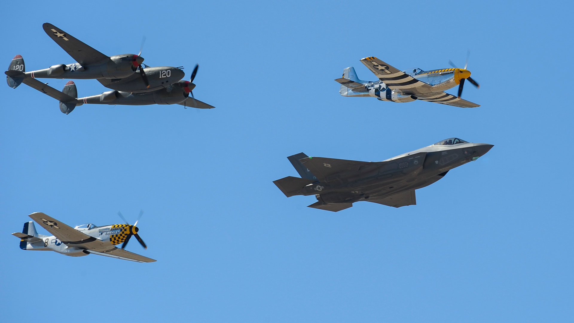 Two P-51 Mustangs, an F-35 Lightning II and a P-38 Lightning fly in formation during the 2016 Heritage Flight Training and Certification Course at Davis-Monthan Air Force Base, Ariz., March 5, 2016.