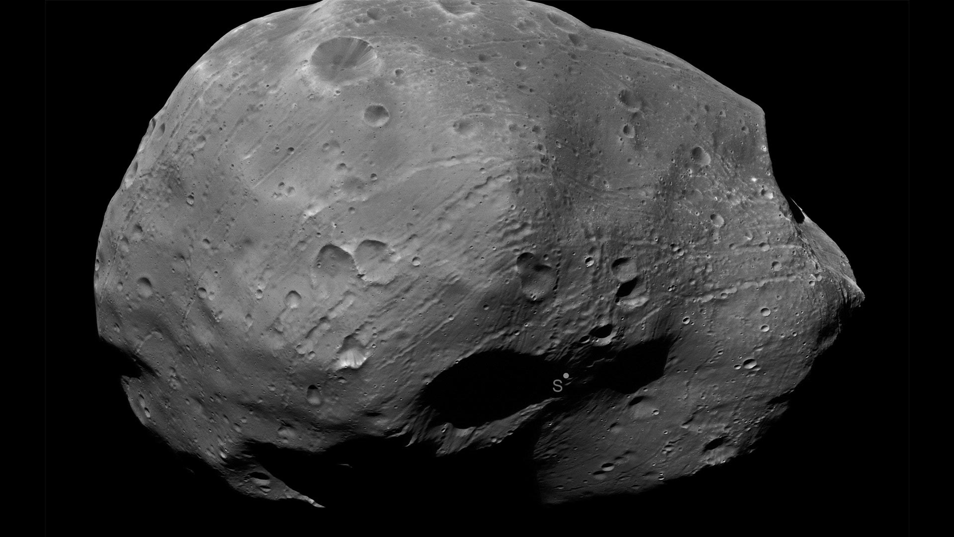 Phobos is a moon of Mars, a body that a team from the Planetary Science Institute could study in the name of future exploration. The "S" in the image indicates the south pole of the moon.