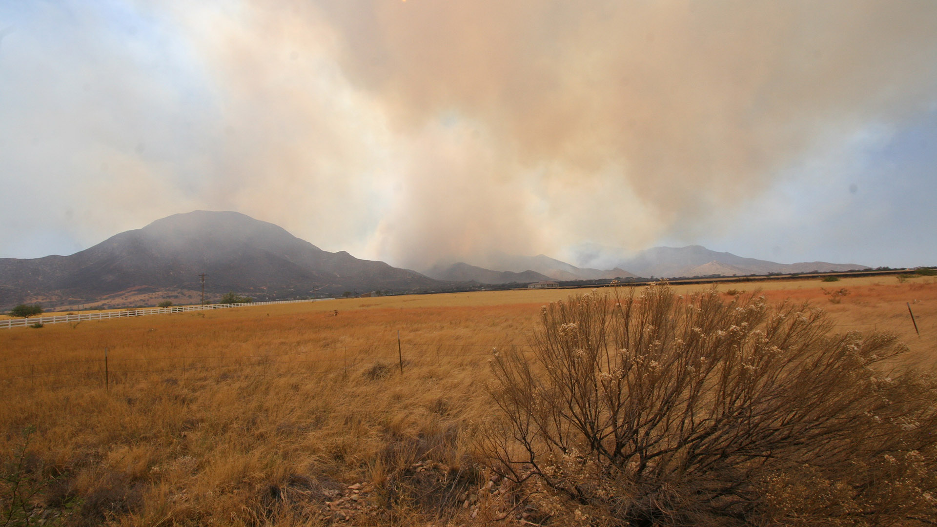 The Wallow Fire burns in the distance, in 2011.