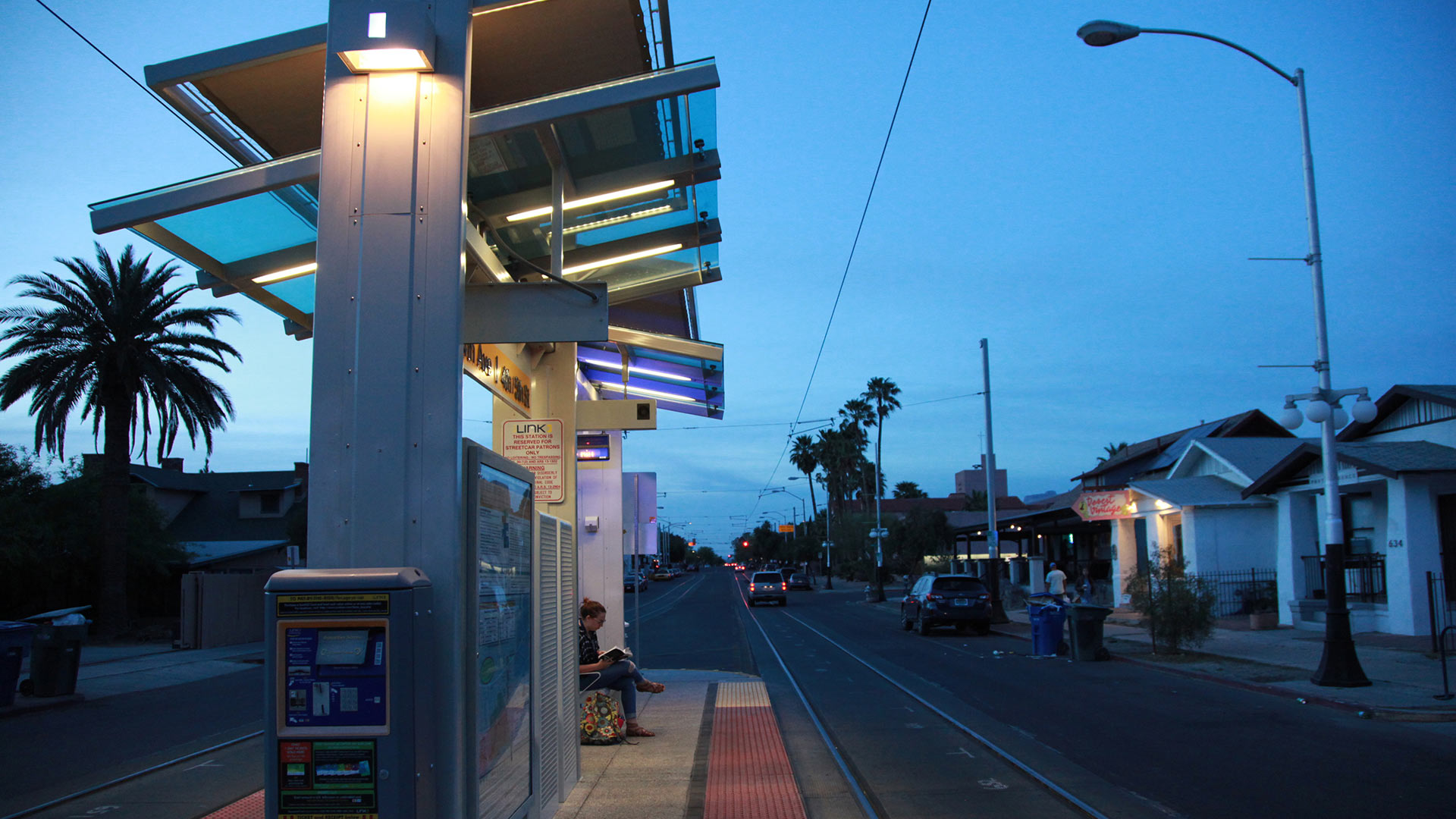 A woman waits for the streetcar on April 5, 2016. 