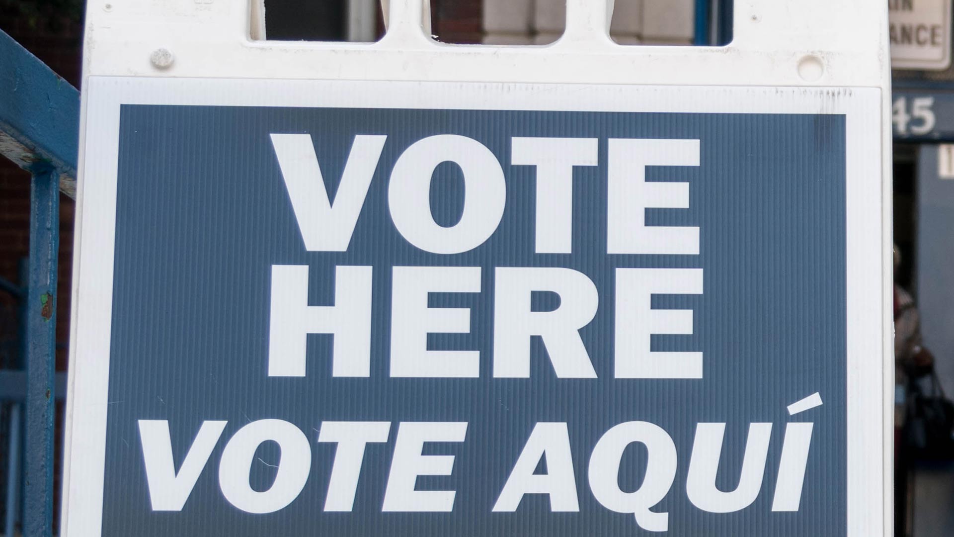 A Vote Here sign outside a polling place.