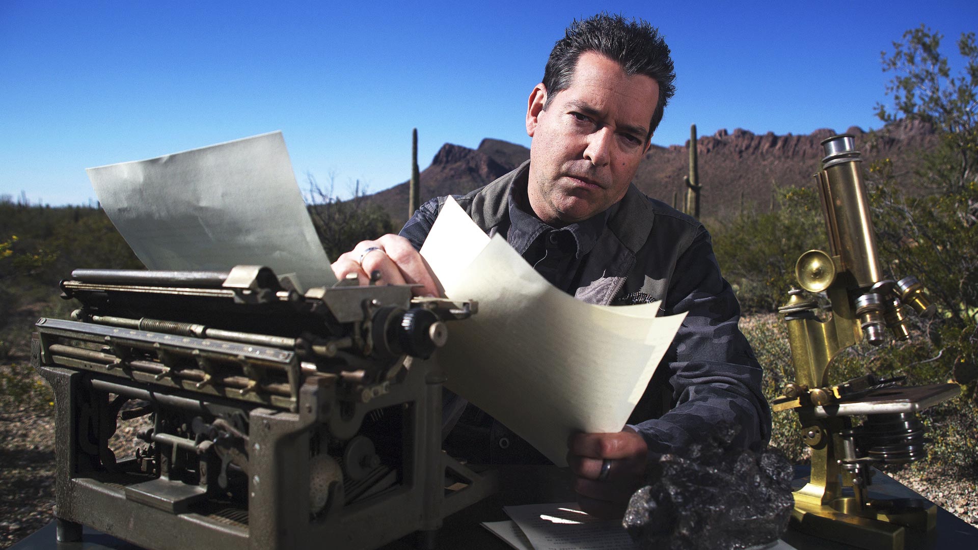 Geoff Notkin crunches some meteorite data while at his spacious desert field desk.