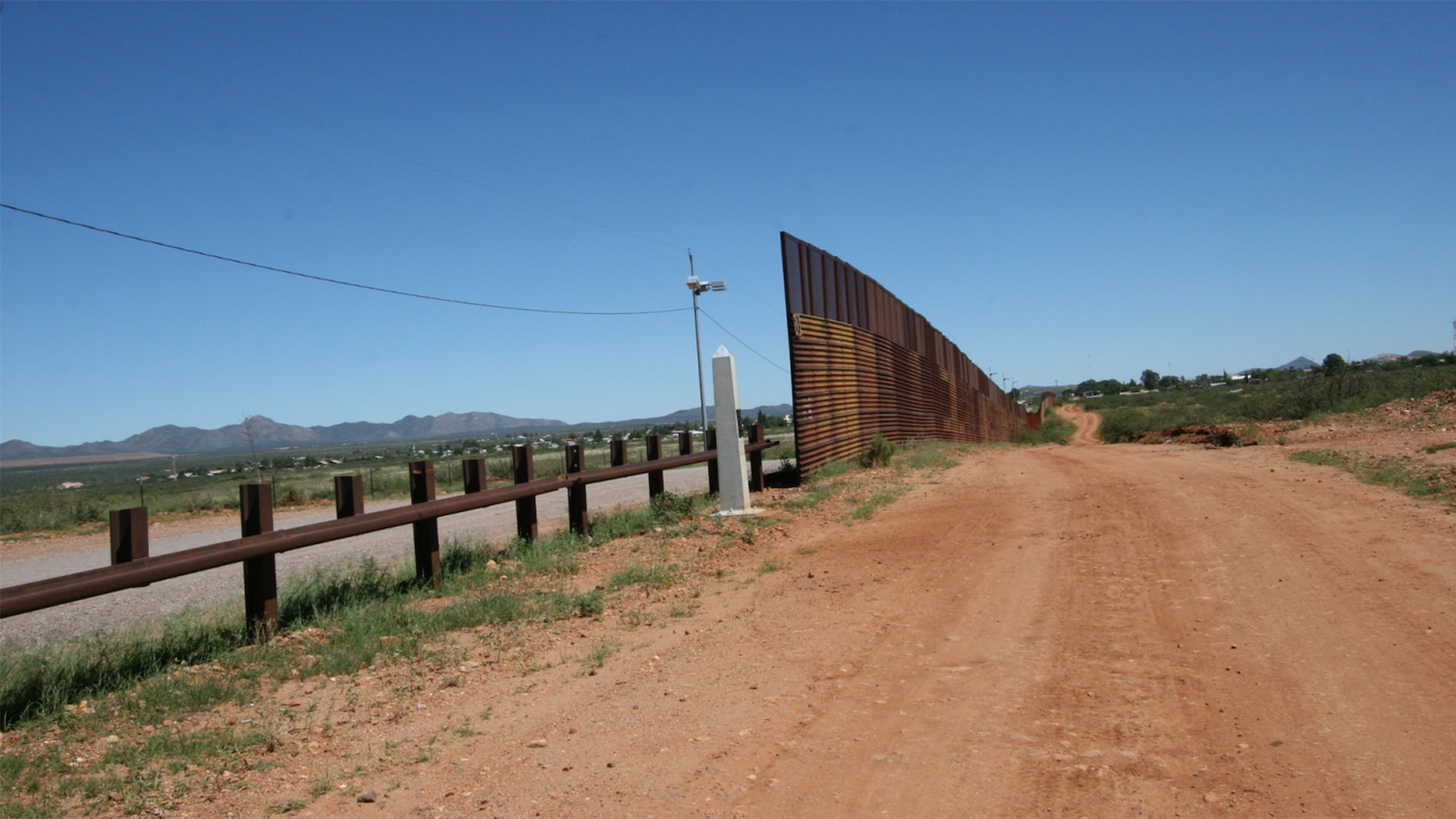 The old border wall made of military landing platform that stood for years dividing Naco, Arizona, and Naco, Sonora.