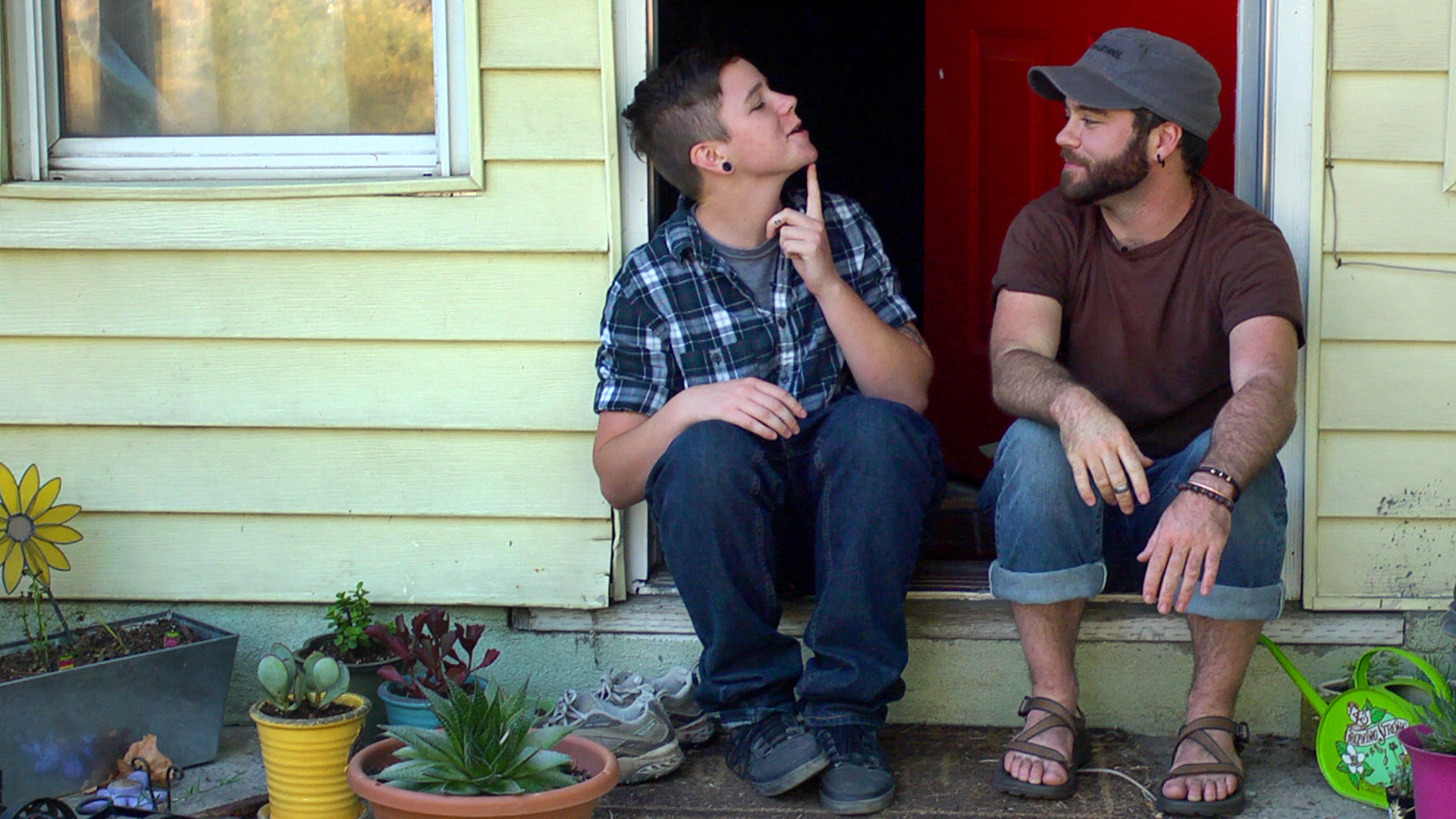 Trans teen Bennett shows his first chin hair to his friend and mentor, Joe Stevens.