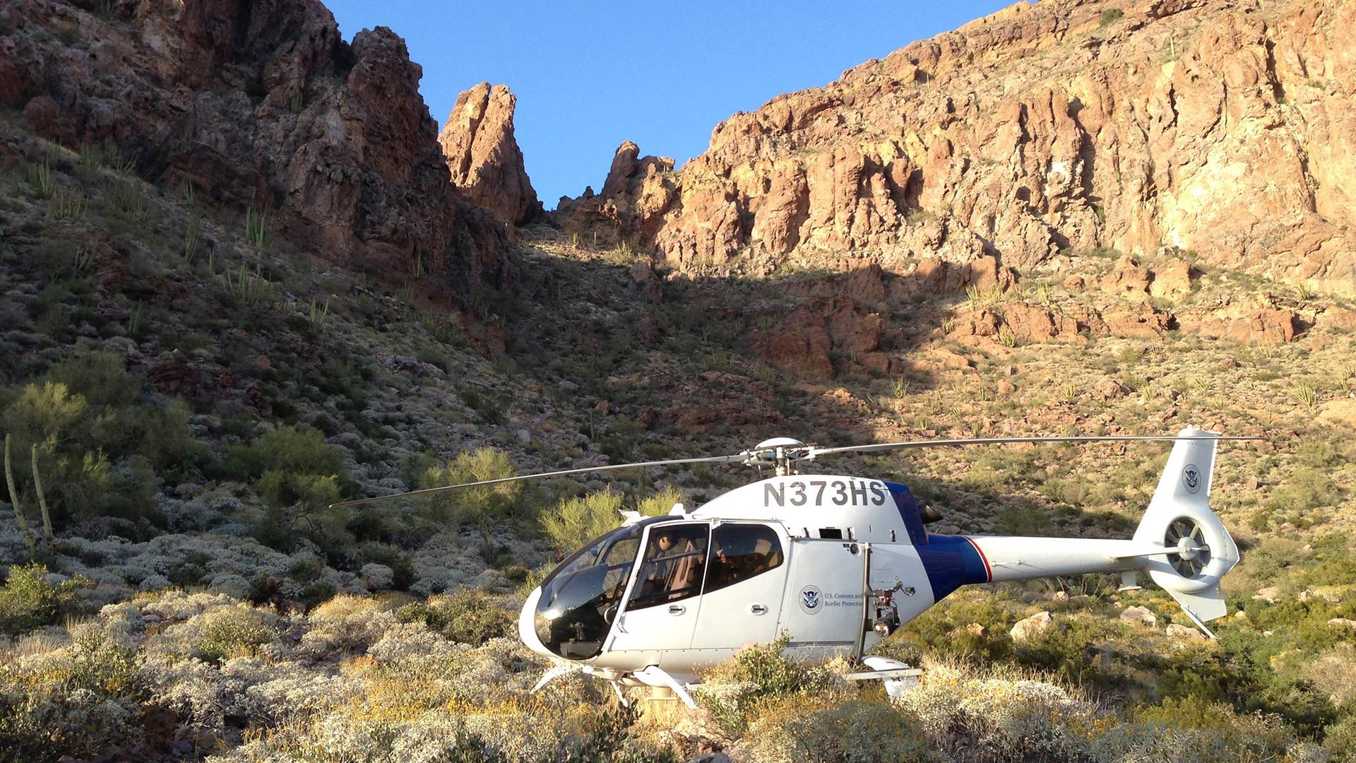 A Customs and Border Protection helicopter and crew near Yuma, Arizona.