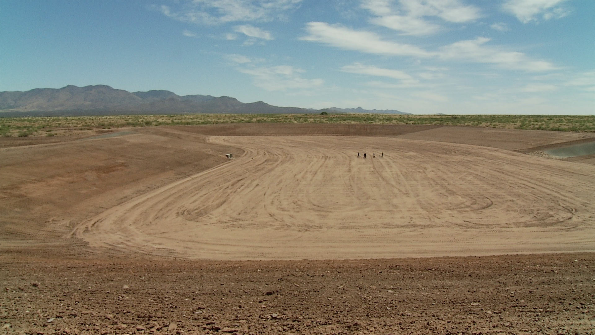 The Horseshoe Draw Project sits on 38 acres. The bottom of the basin takes up nine acres and sits 22 feet below ground level. 263,000 cubic yards of dirt were removed to create the project.