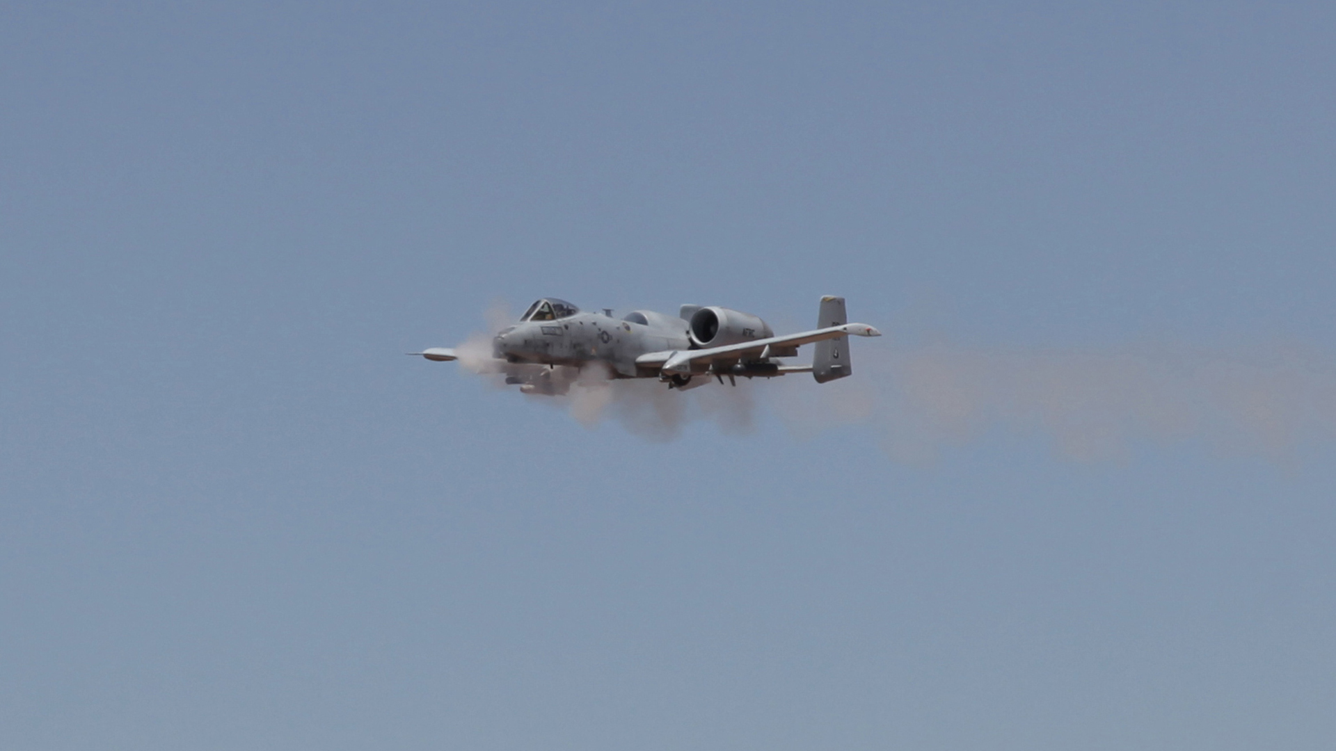 An A-10 from Davis-Monthan Air Force Base fires its gun at the Goldwater Range during the Hawgsmoke competiton.  June 2016