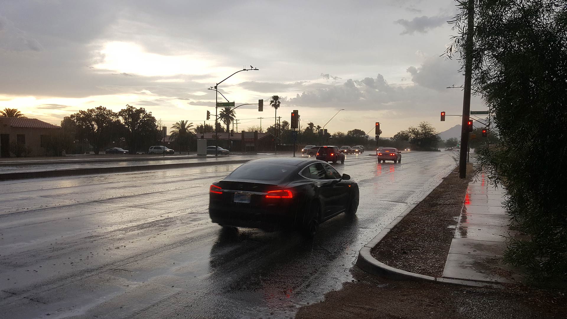 Cars drive down Campbell Avenue during a brief monsoon storm. From July 2017.