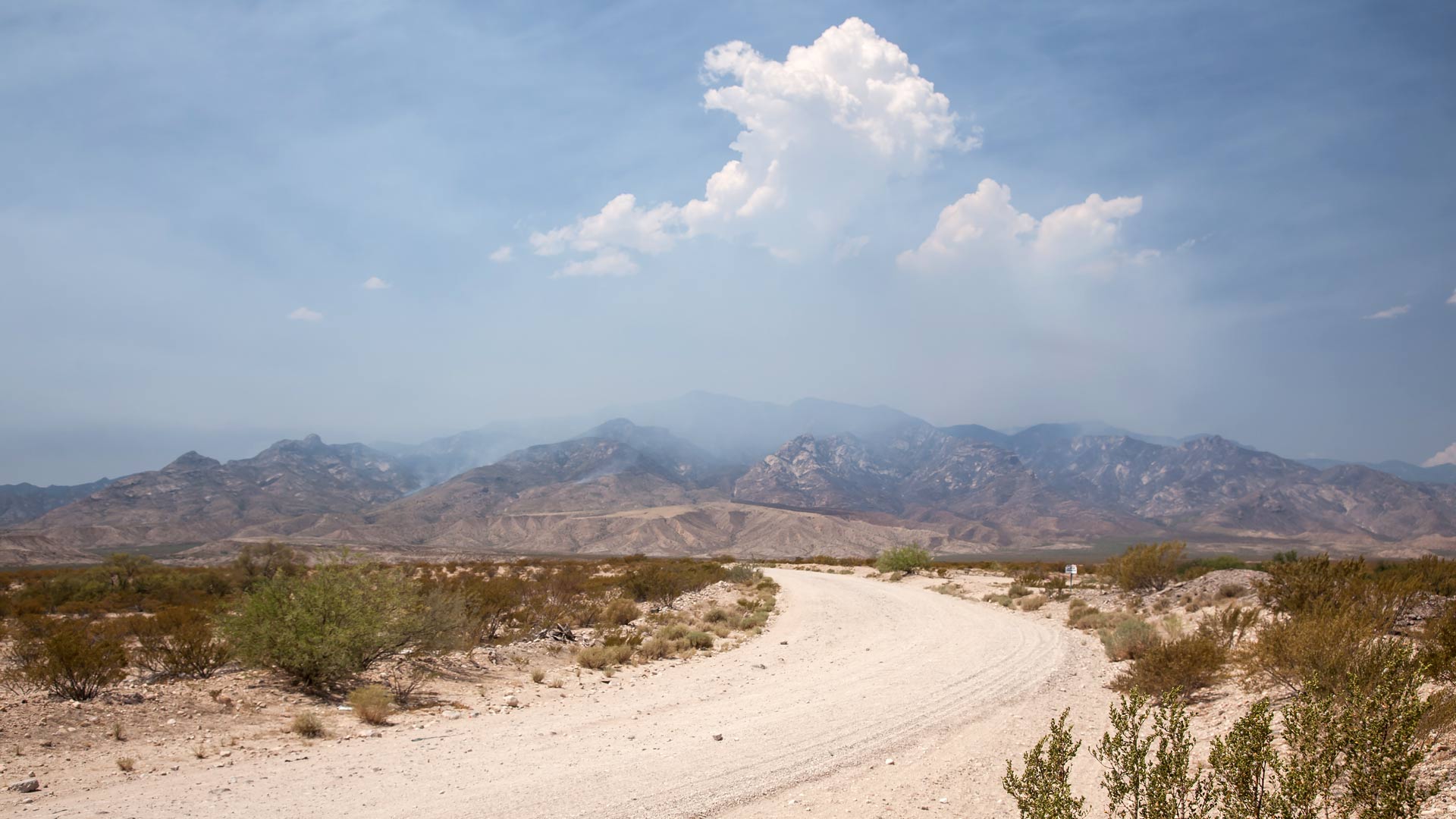 Smoke from the Frye Fire hovers over the Pinaleño Mountains.
