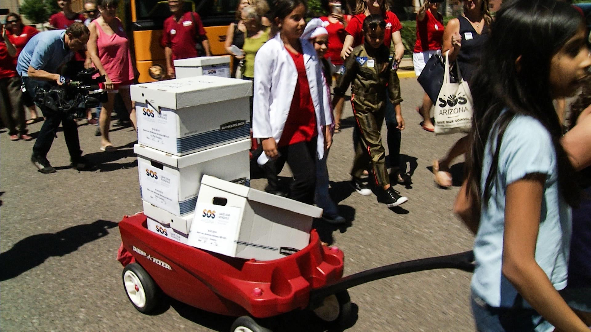 The group Save Our Schools delivered more than 111,000 signatures to temporarily suspend a law expanding school vouchers in Arizona.