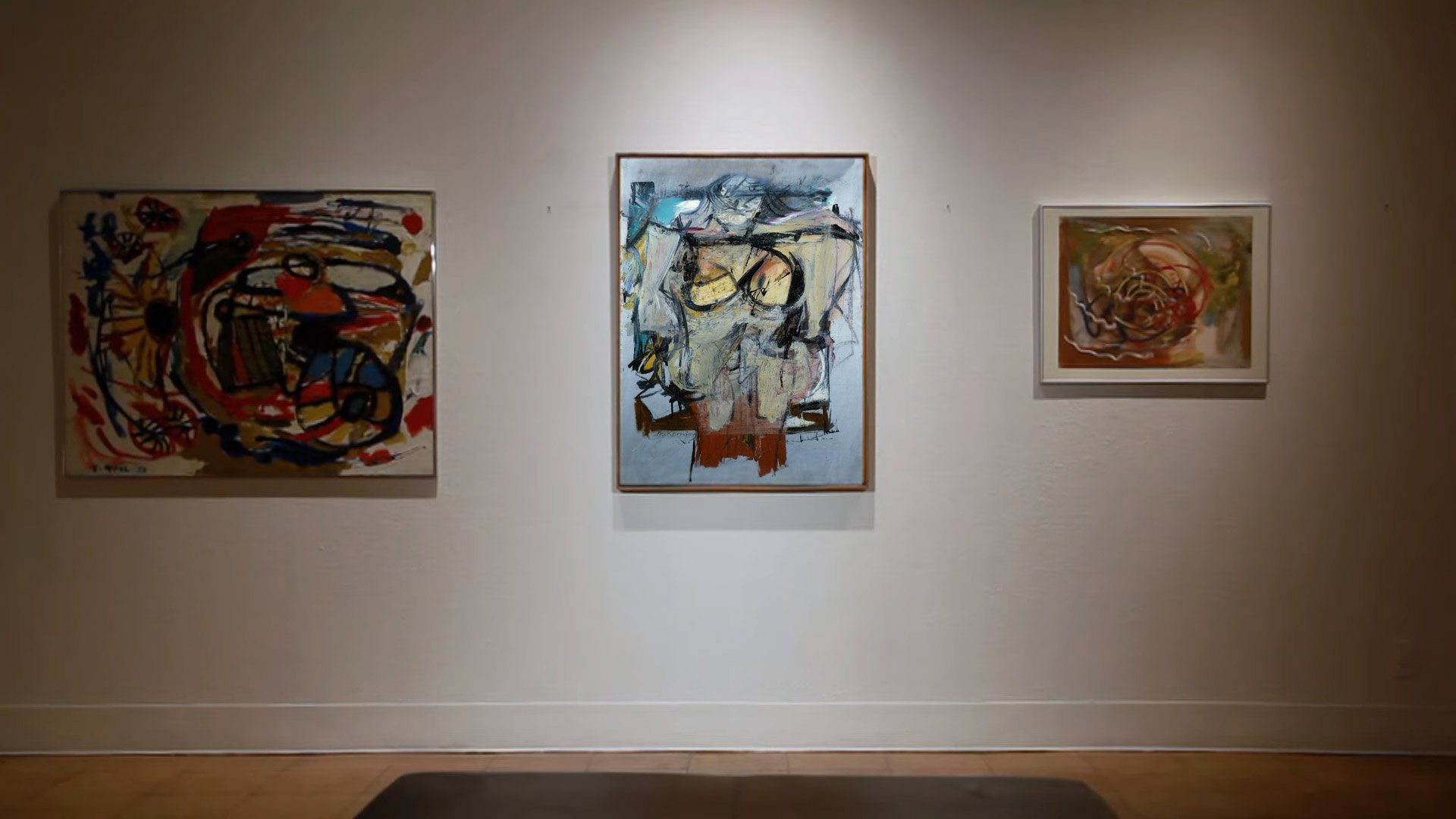 A recreation of a gallery scene, with the Willem de Kooning painting "Woman - Ochre" at center.