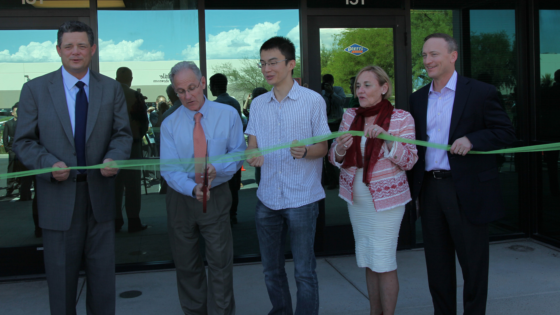 From left, Sun Corridor CEO Joe Snell, Tucson Mayor Jonathan Rothschild, TuSimple CTO Xiaodi Hou, Pima County Supervisor Sharon Bronson and Sun Corridor Board Chair and UNS Energy CEO Dave Hutchens cut the ribbon at a media event introducing TuSimple's Tucson office.