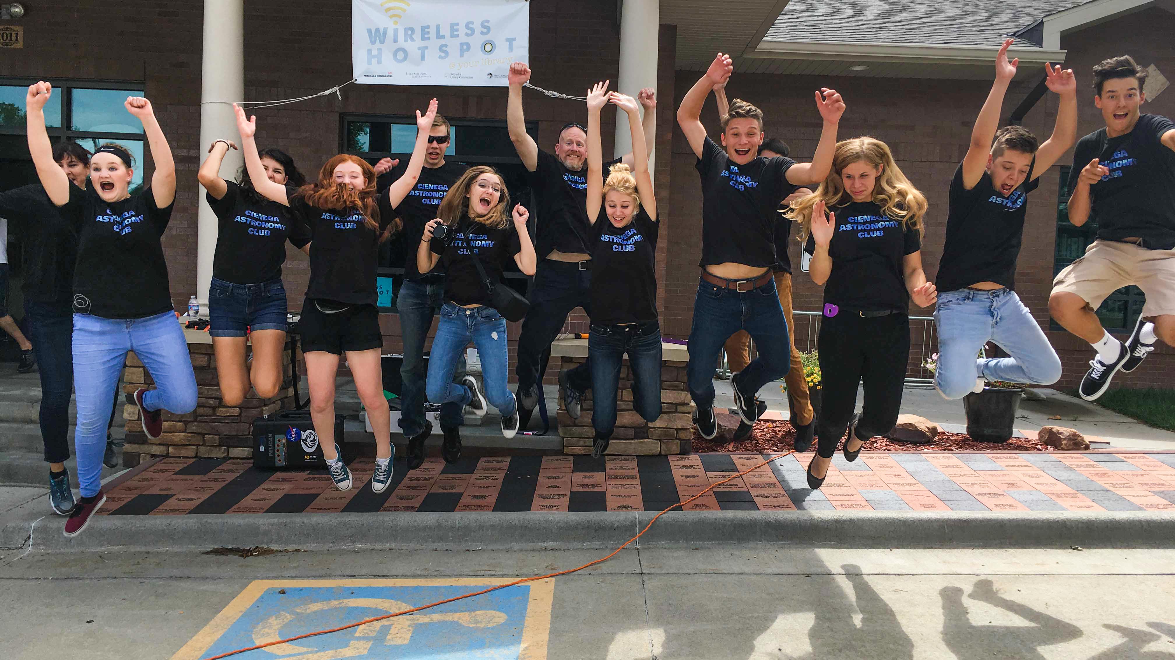 Members of the Cienega High School Citizen Continental-America Telescopic Eclipse Experiment celebrate at the Pawnee City (Nebraska) Library during the Great American Eclipse, Aug. 21, 2017.