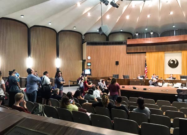 Phoenix City Council chambers clear out as community members wait to speak on Aug. 30, 2017.