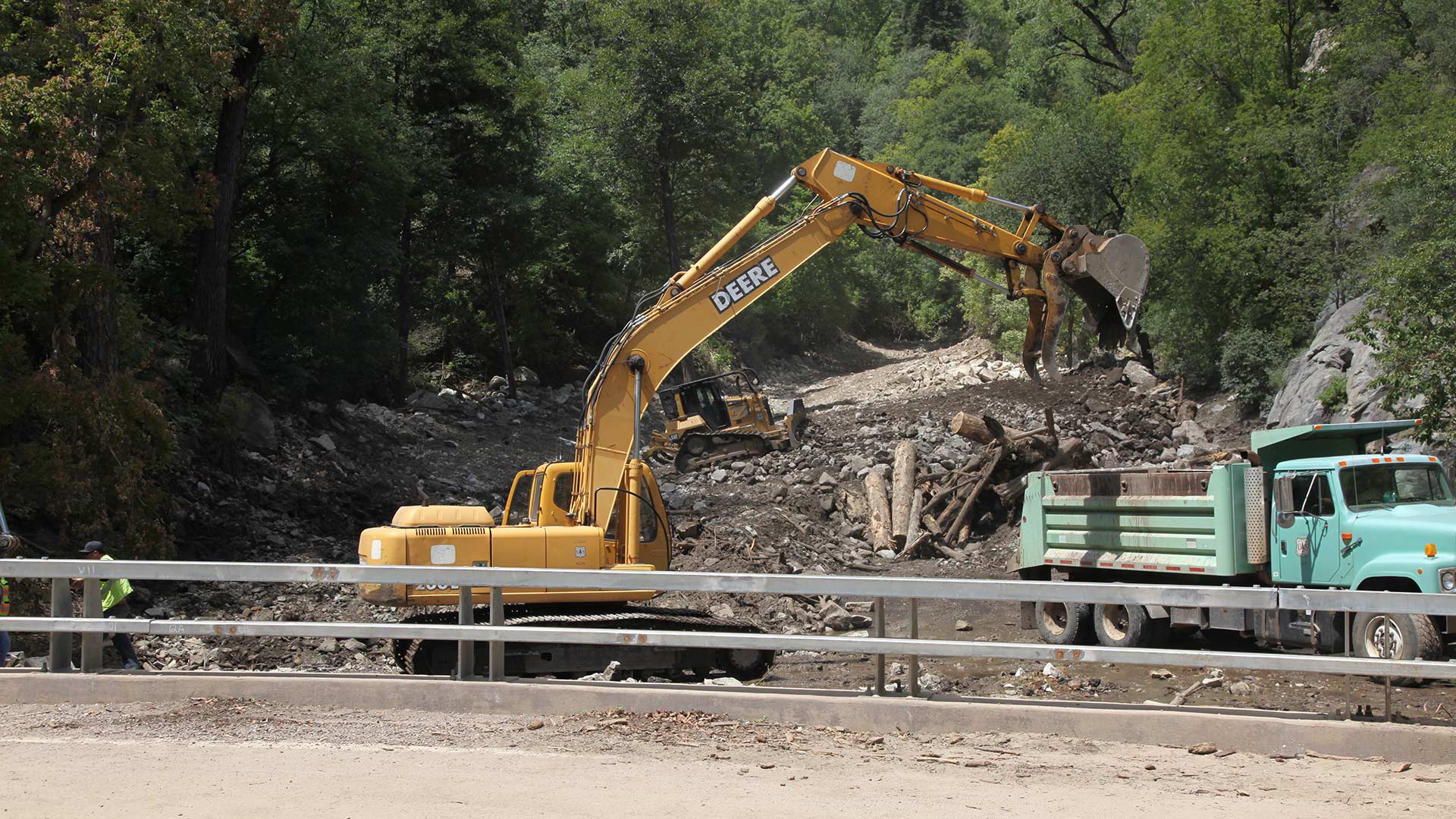 Crews work to clear Wet Canyon on Mount Graham. The canyon was overrun with debris and sediment when multiple storms brought heavy rainfall to areas that were severely burned during the Frye Fire.