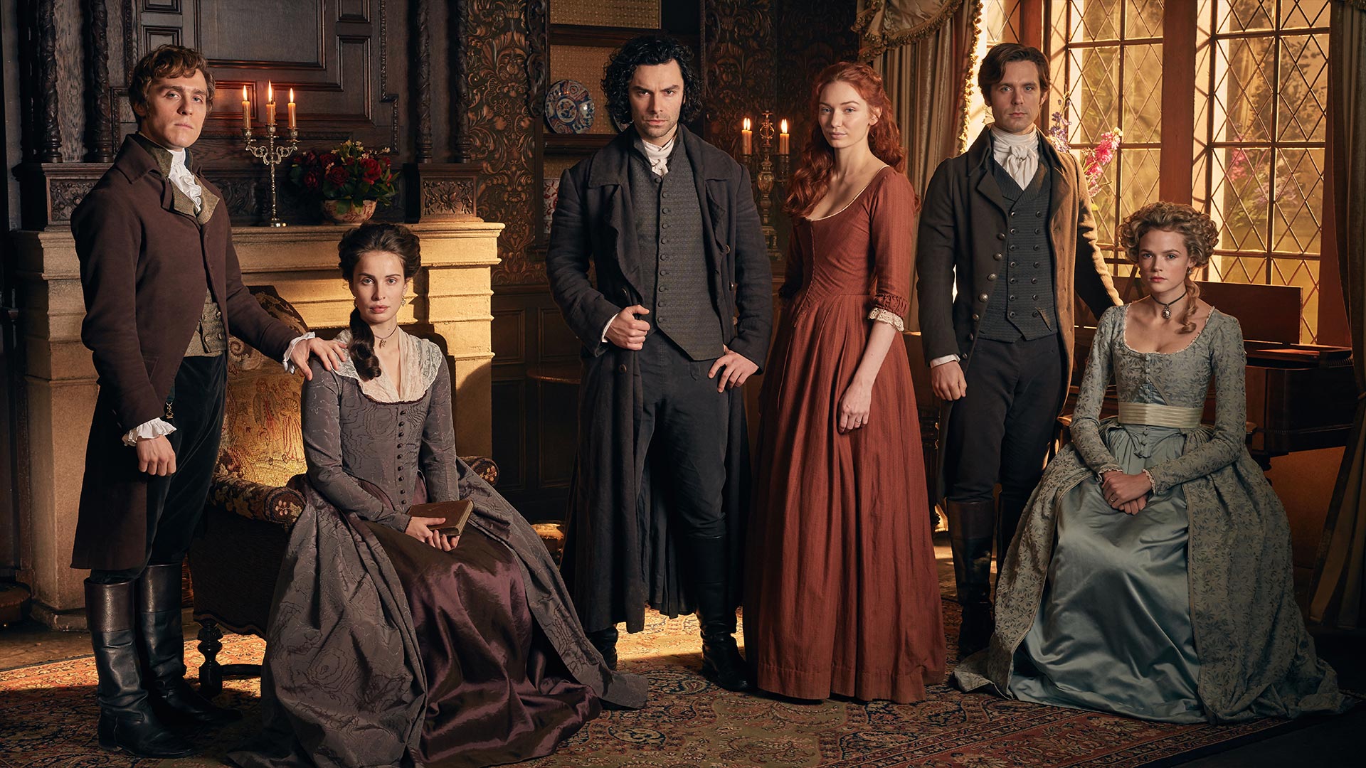 Shown from left to right: Jack Farthing as George Warleggan, Heida Reed as Elizabeth, Aidan Turner as Ross Poldark, Eleanor Tomlinson as Demelza, Luke Norris as Dr. Dwight Enys and Gabriella Wilde as Caroline Penvenan