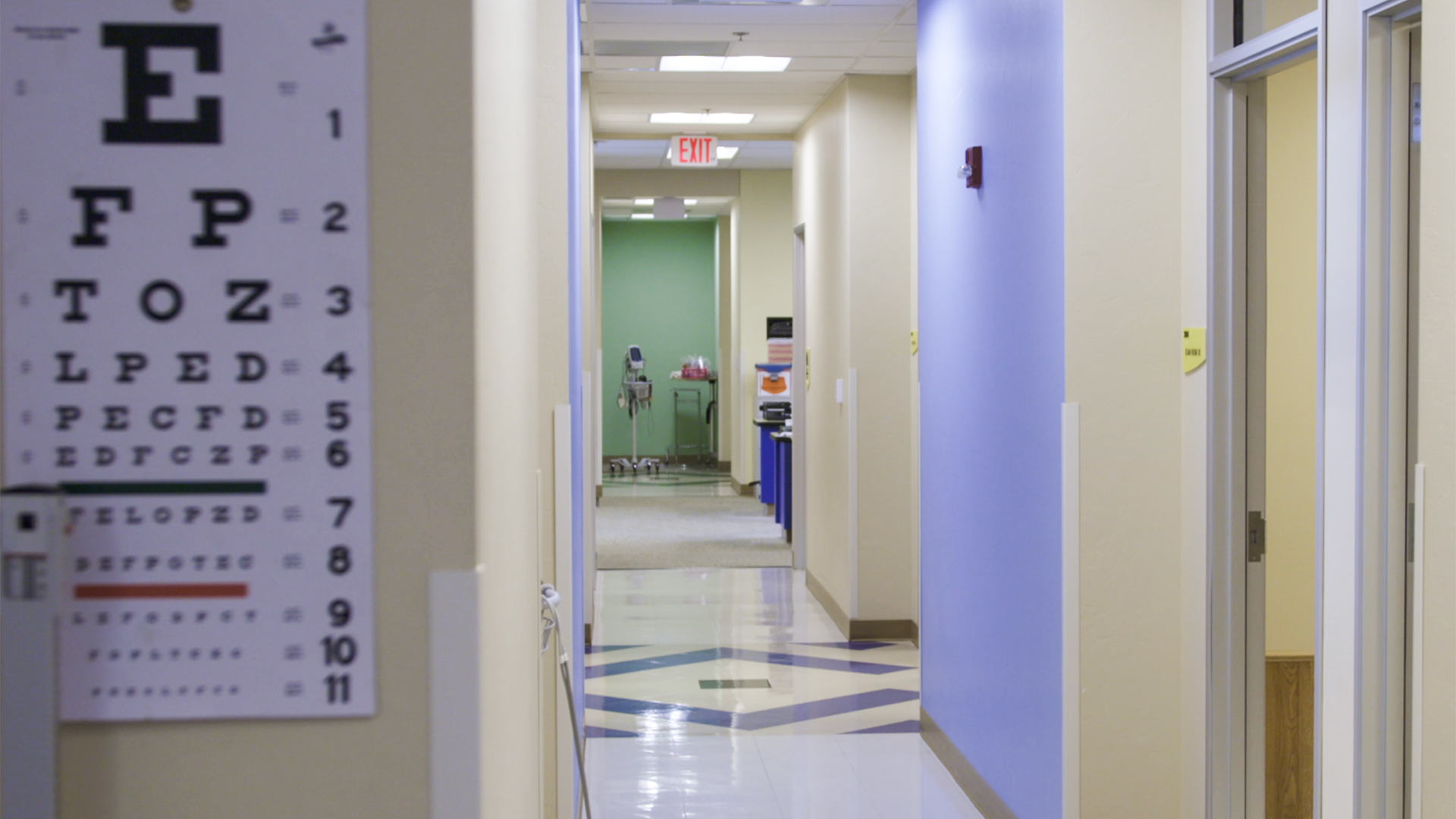 An eye exam hangs on the wall of a health clinic.