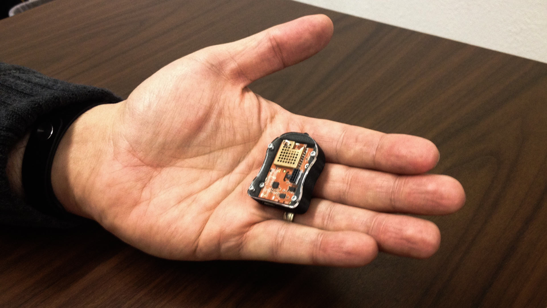 University of Arizona mining engineering professor Moe Momayez holds a sensor developed to warn miners and other workers of hazardous conditions.