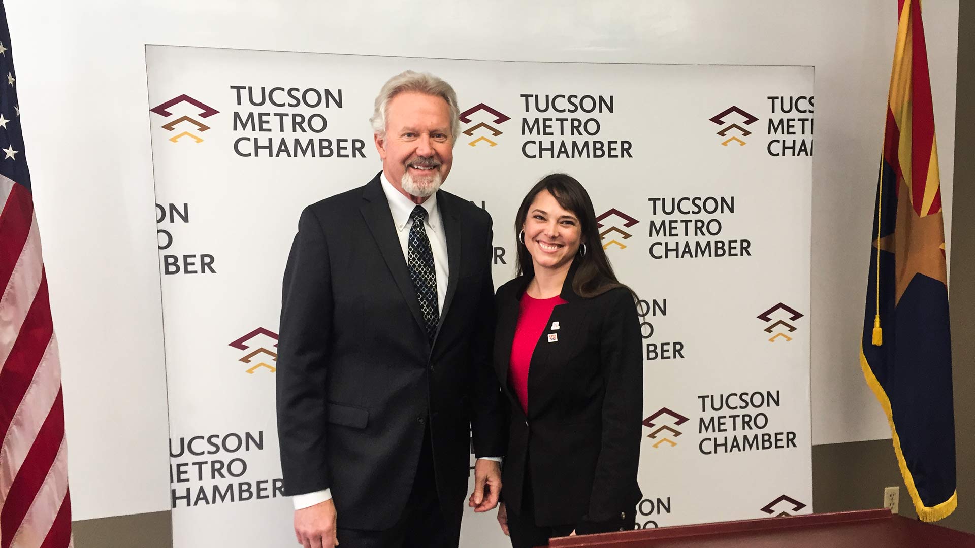 Amber Smith, right, takes over from Mike Varney, left, as president and CEO of the Tucson Metro Chamber of Commerce.