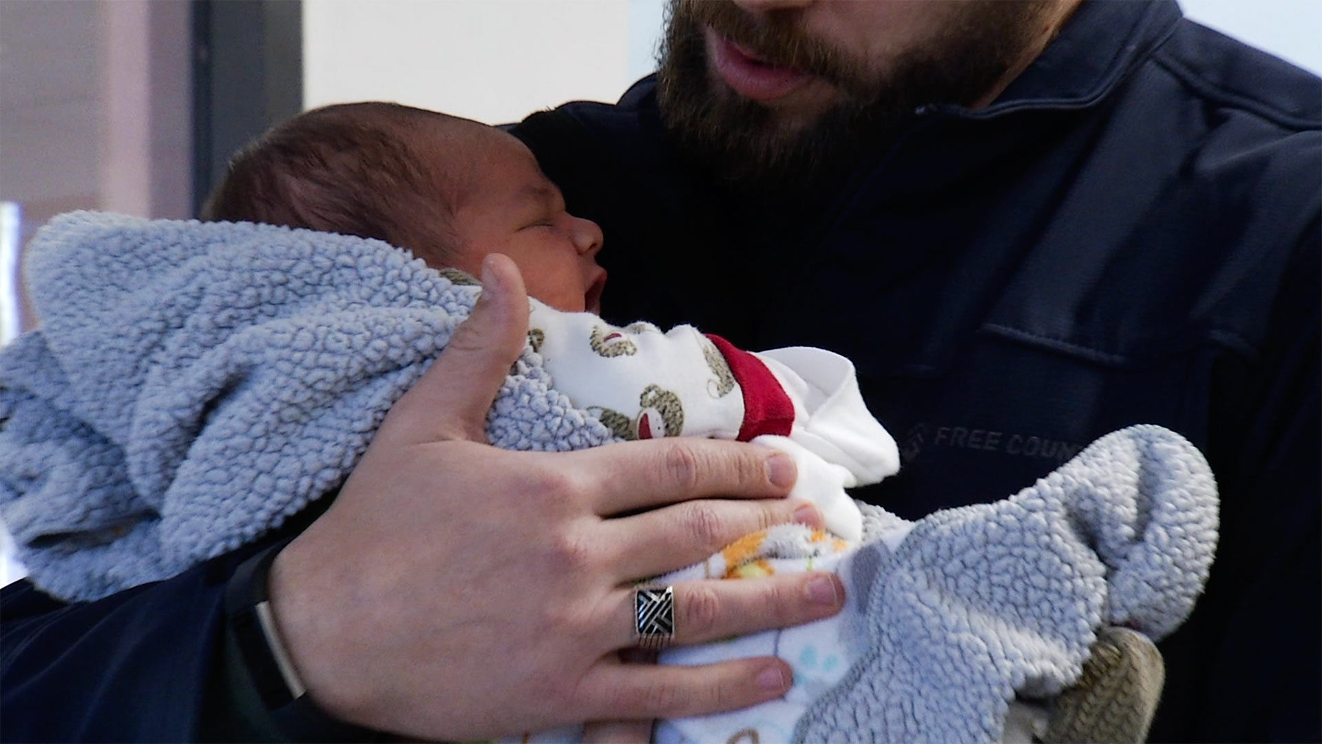 A father brings his infant child to El Rio Community Health Center for a checkup.