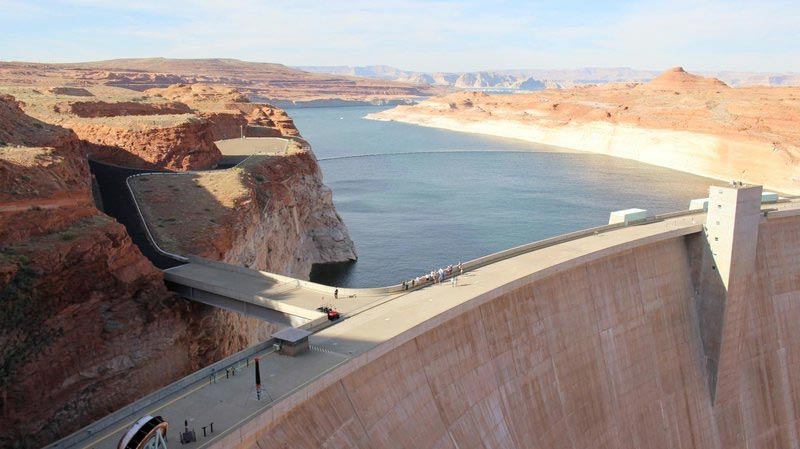 Lake Powell stores water from the Colorado River and straddles the Arizona-Utah border. It is currently storing less than half of its capacity.