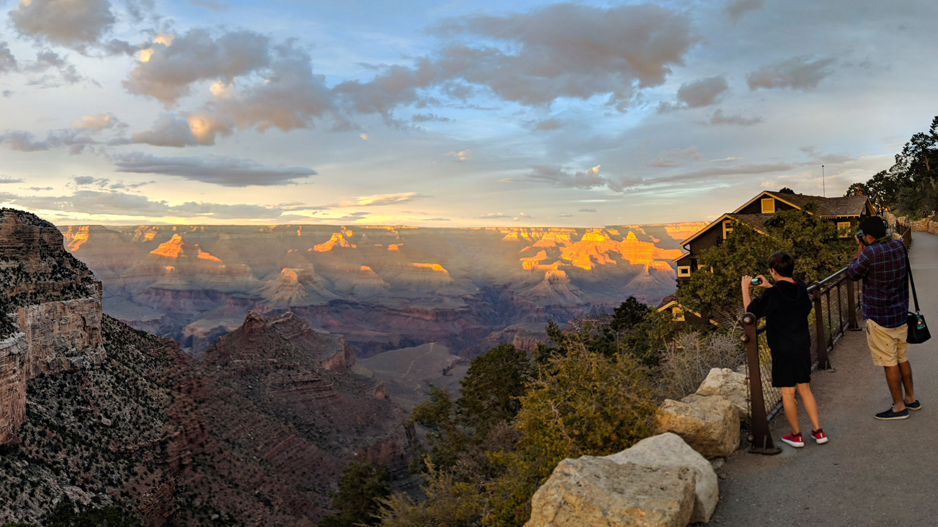 Visitors to the Grand Canyon's South Rim snap photos as the sun goes down, September 2018.