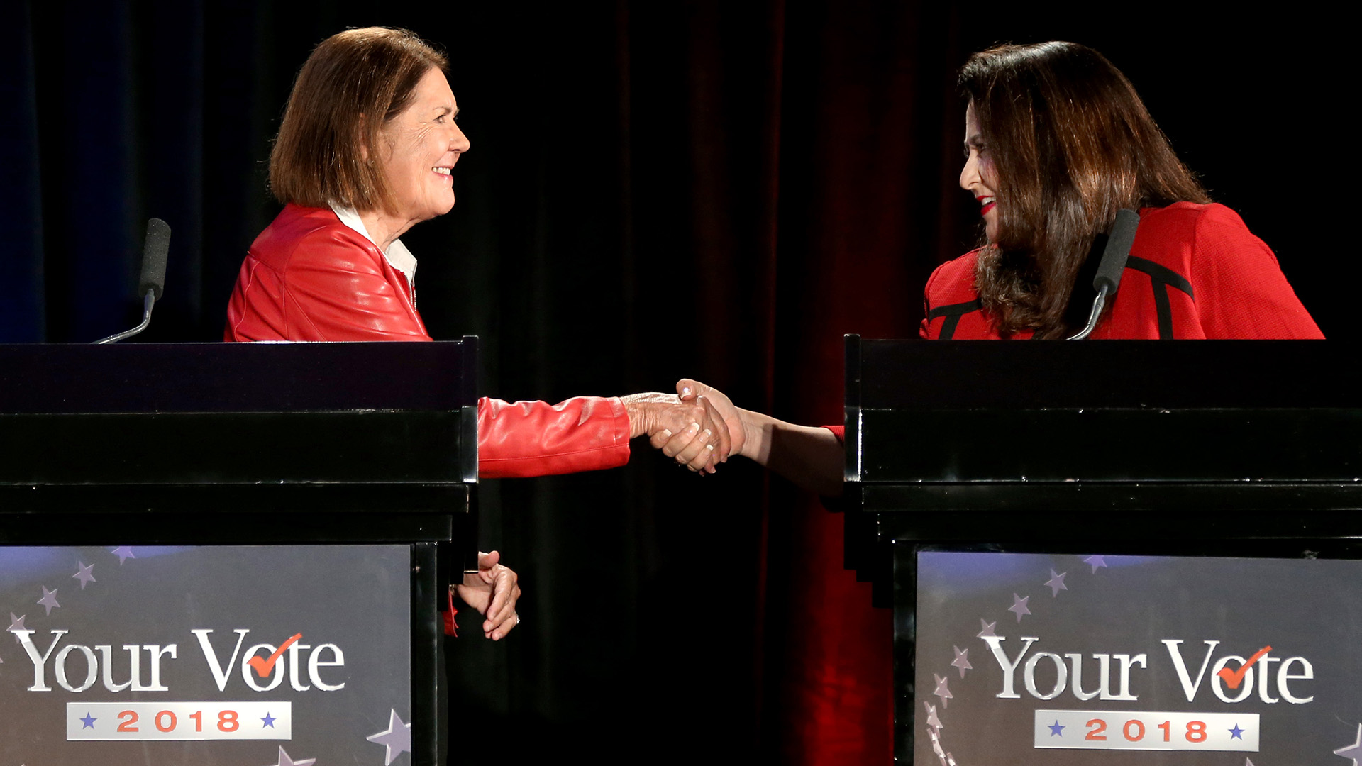 Candidates for the 2nd Congressional District, Democrat Ann Kirkpatrick, left, and Republican Lea Marquez Peterson, shake hands following a televised debate at the Tucson Jewish Community Center, Tuesday, Oct. 9, 2018, Tucson, Arizona.