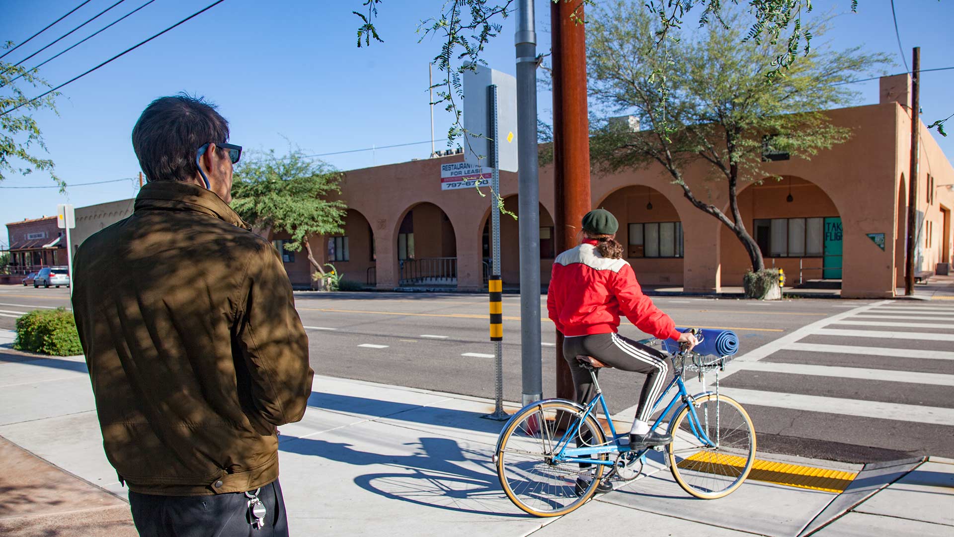 An employee of the Pima Association of Governments makes a note of non-motorized travel for the annual bike and pedestrian count. 