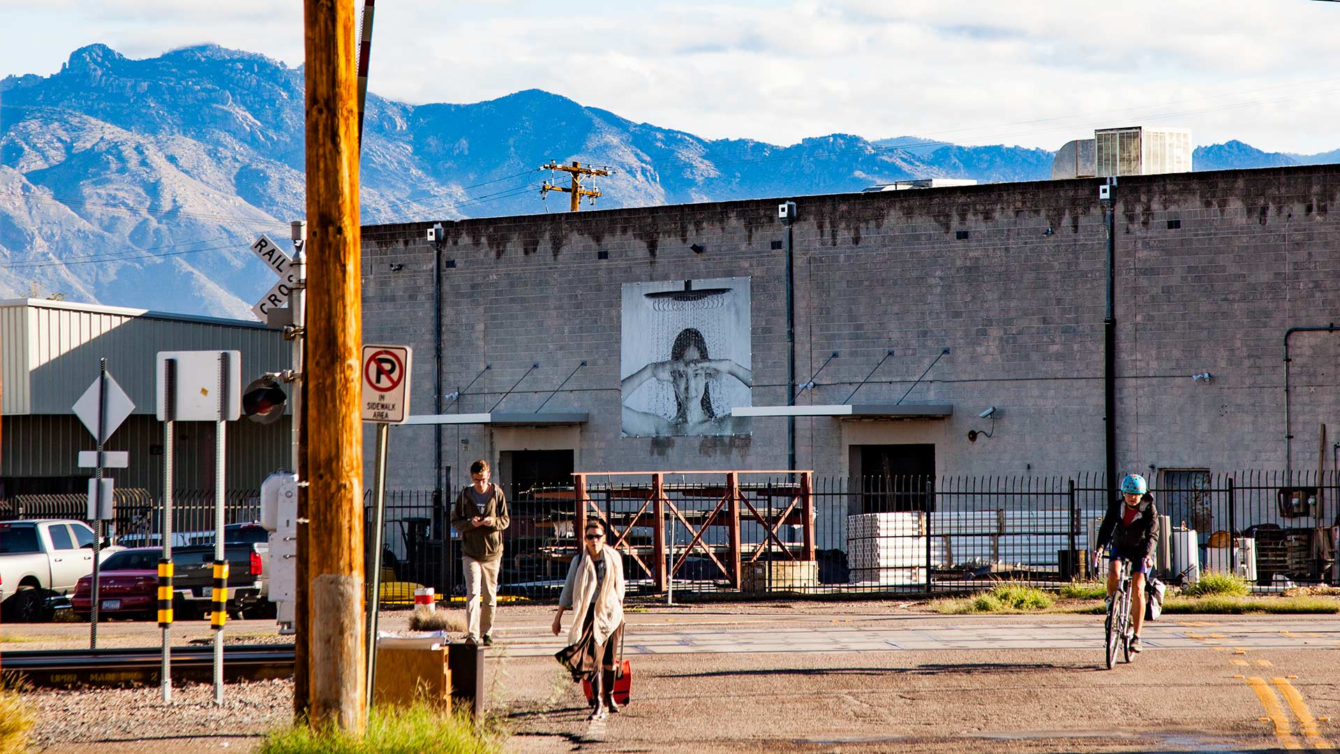 A bicyclist and pedestrians on their morning commute, Oct. 16, 2018, the day of the Pima Association of Governments annual bike and pedestrian count. 