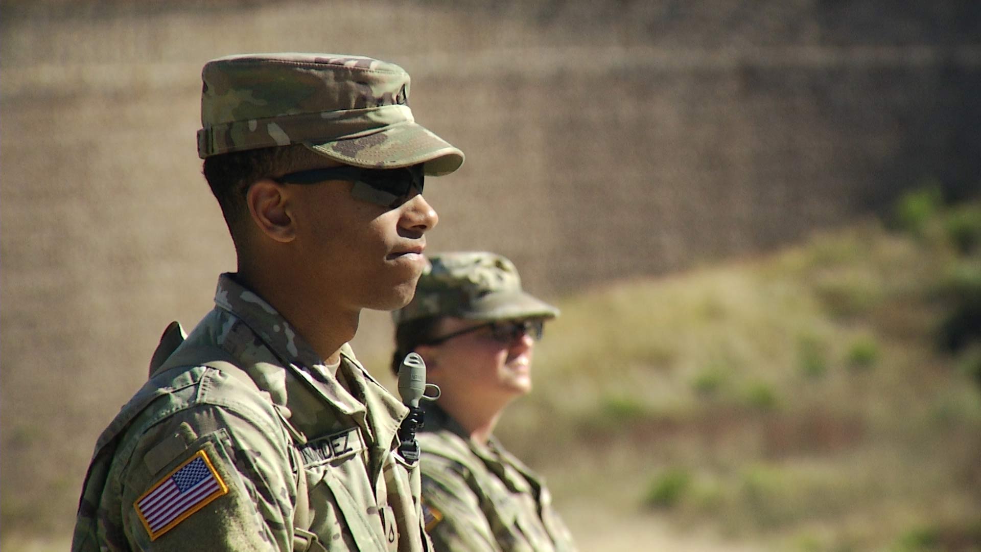 Two soldiers stand watch as an engineering battalion installs concertina wire along the border wall in Nogales on Thursday, Nov. 15, 2018. The soldiers' deployment to the U.S.-Mexico border is part of Operation Secure Line. 