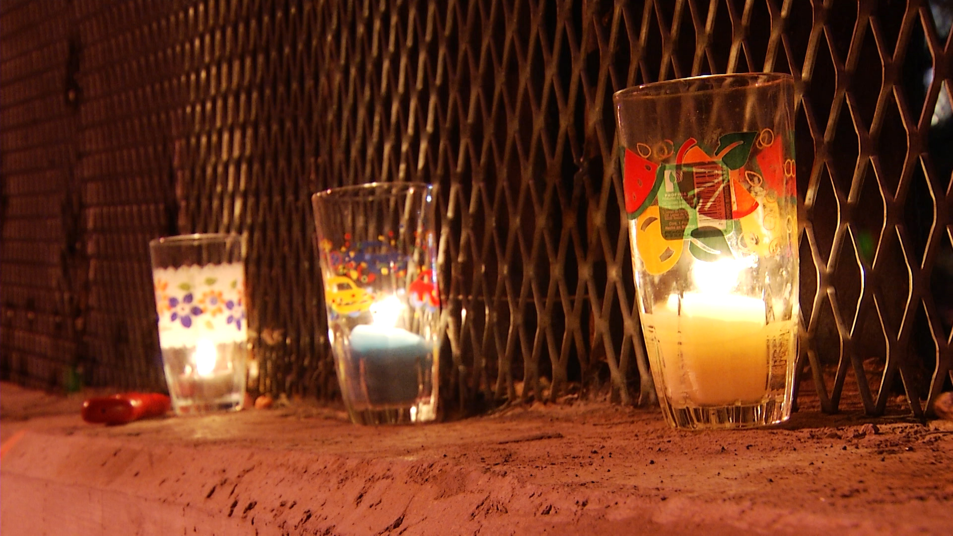 Candles lit for a vigil burn along the U.S.-Mexico border in Nogales, Arizona. 