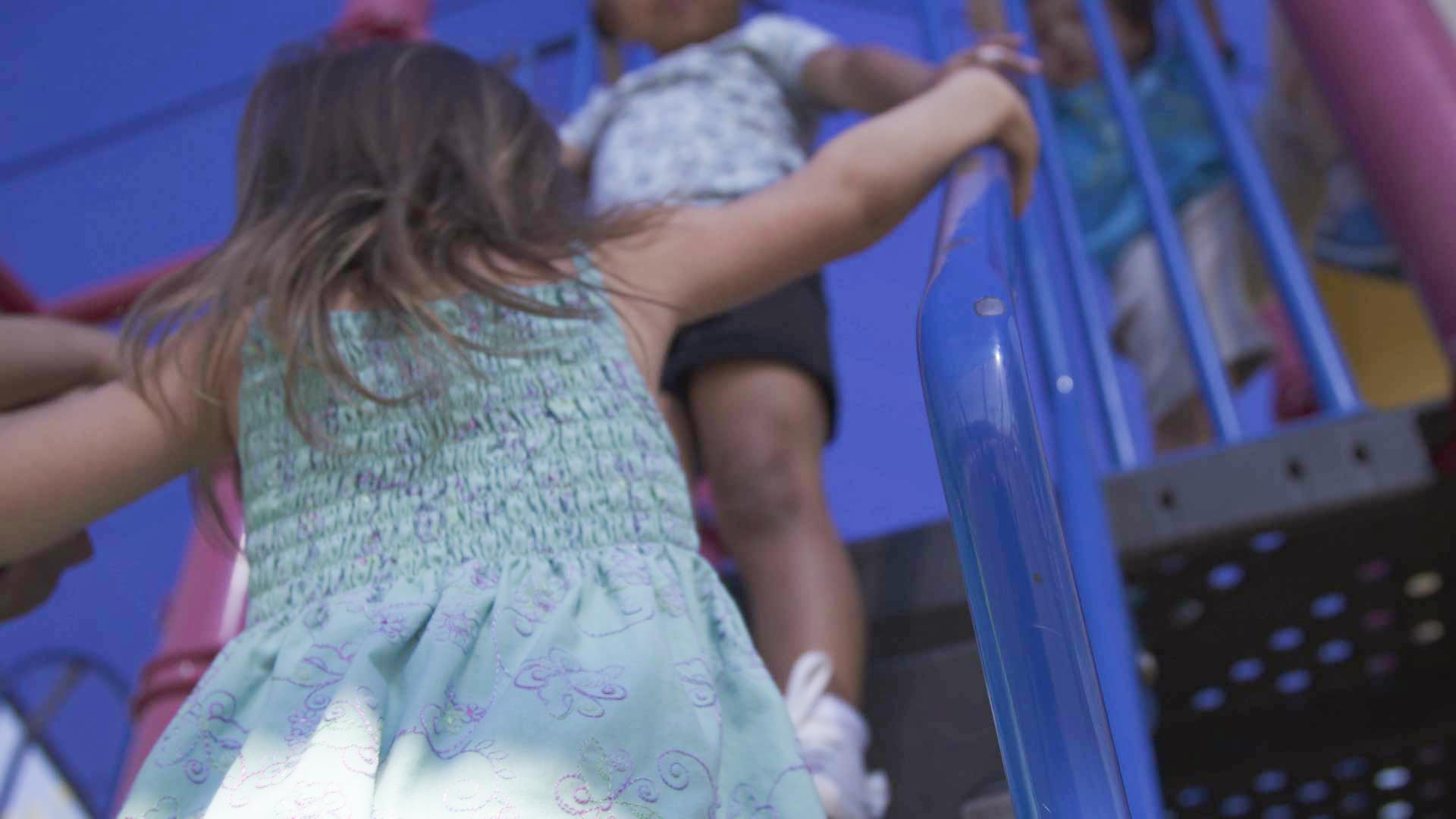 Children play at a playground in Tucson.