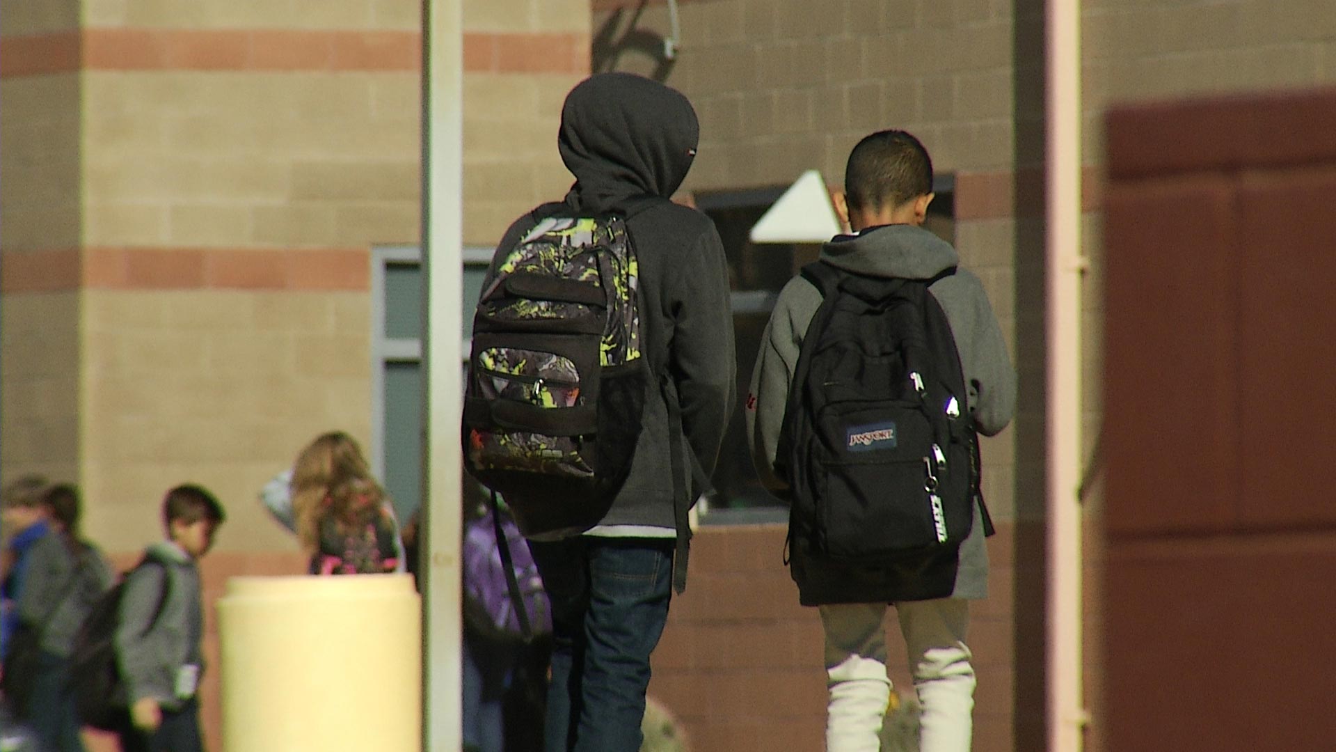 A file image of two students walking on a campus in Pima County.