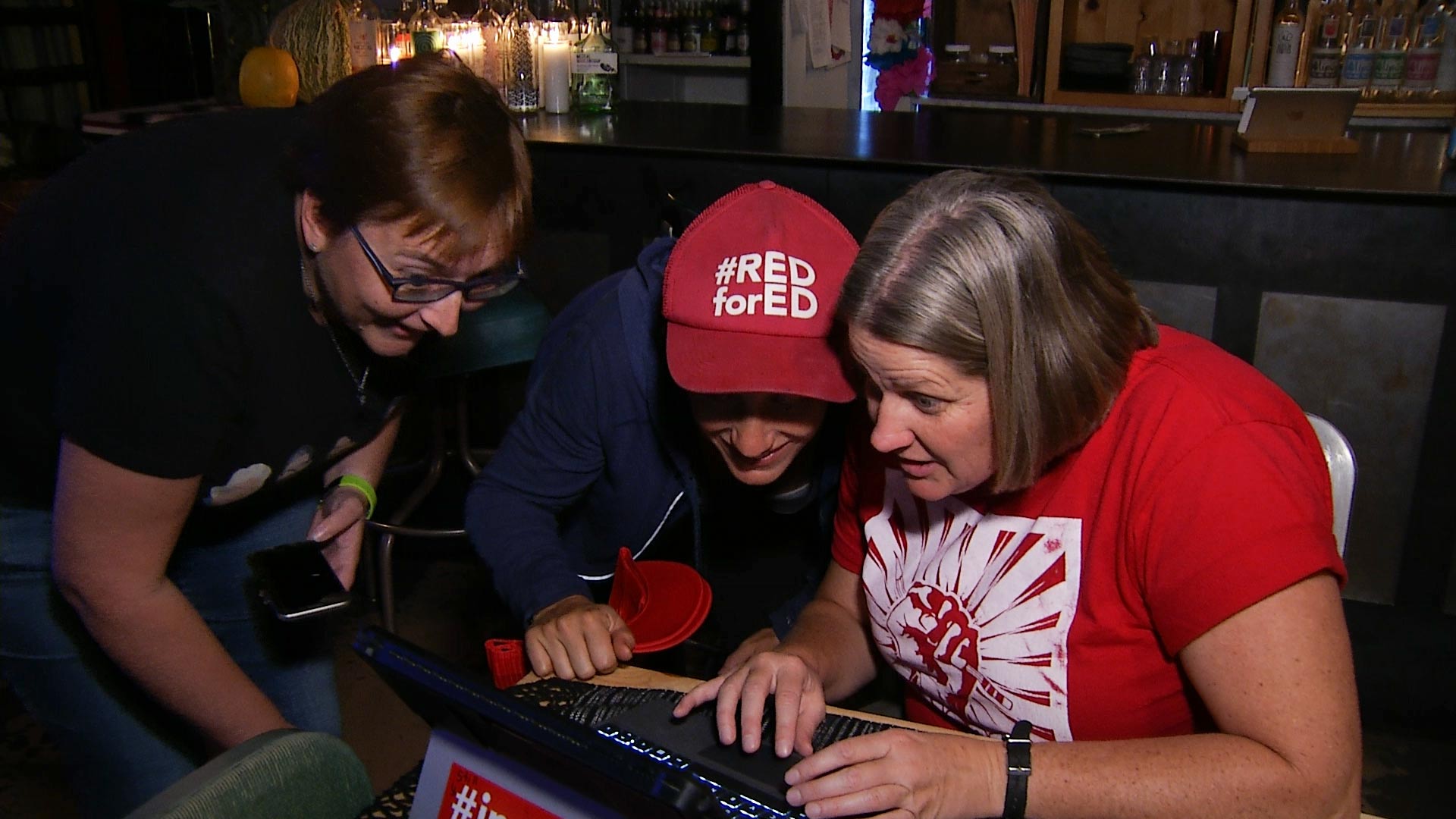 Members of Tucson's #RedforEd education advocate community gather Nov. 6, 2018, to watch the results of the election. 