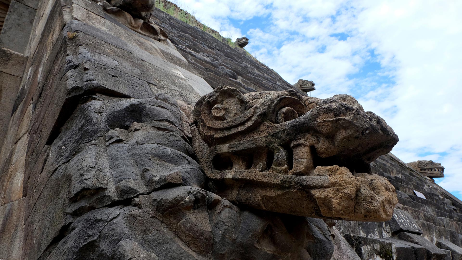 Teoned heads line the staircase of the Pyramid of the Feathered Serpent. Teotihuacan, Mexico.