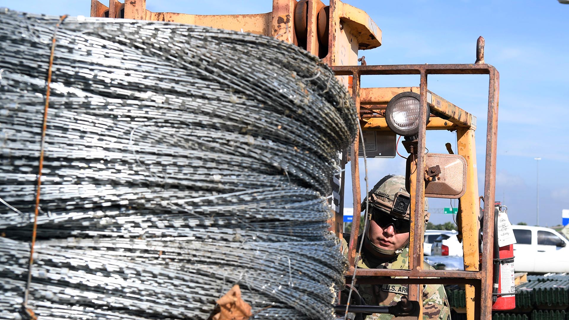 A soldier transports concertina wire destined for a section of border near McAllen, Texas, Nov. 5, 2018. 