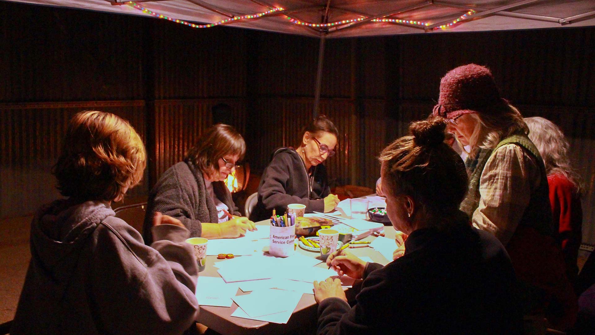 Participants write to incarcerated people at the American Friends Service Committee-Arizona Holiday Cards for Prisoners 2017 event.