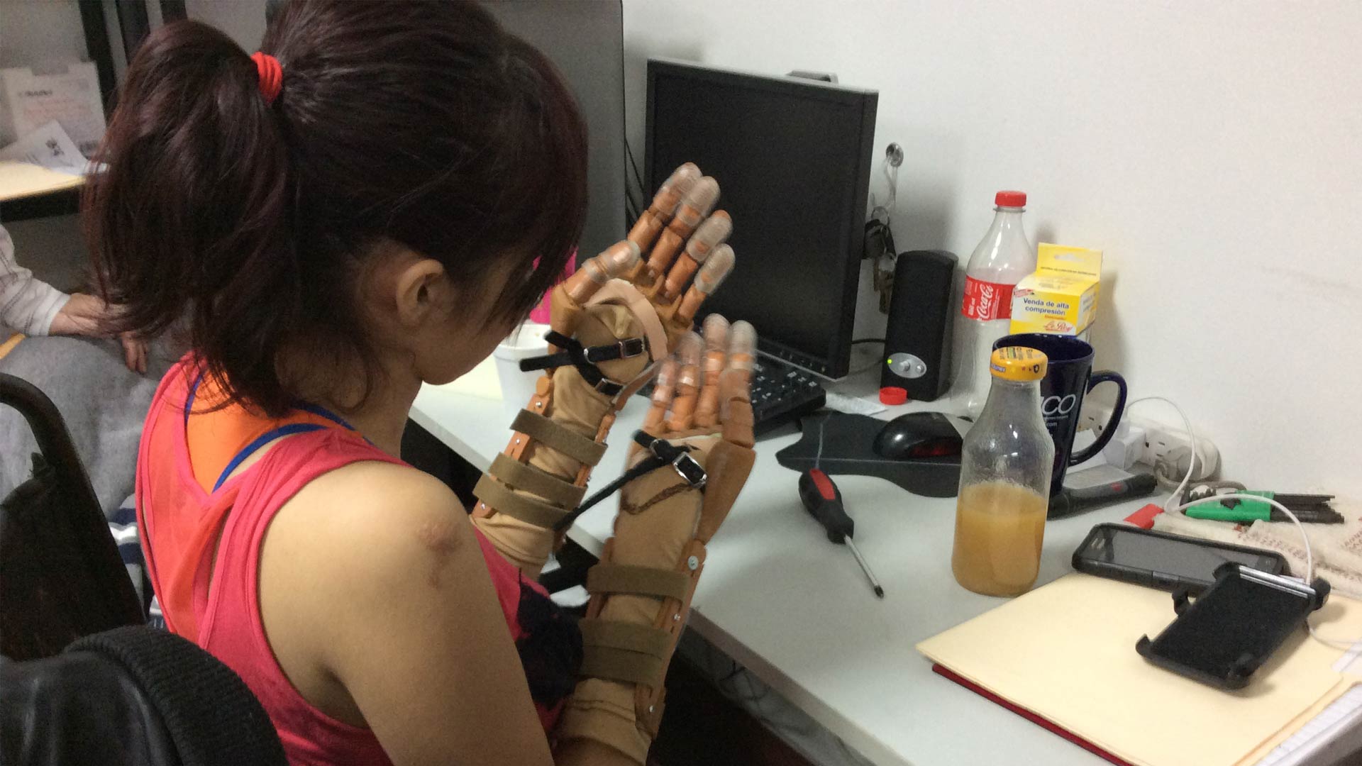 A girl tries on prosthetics designed by Arsobo.