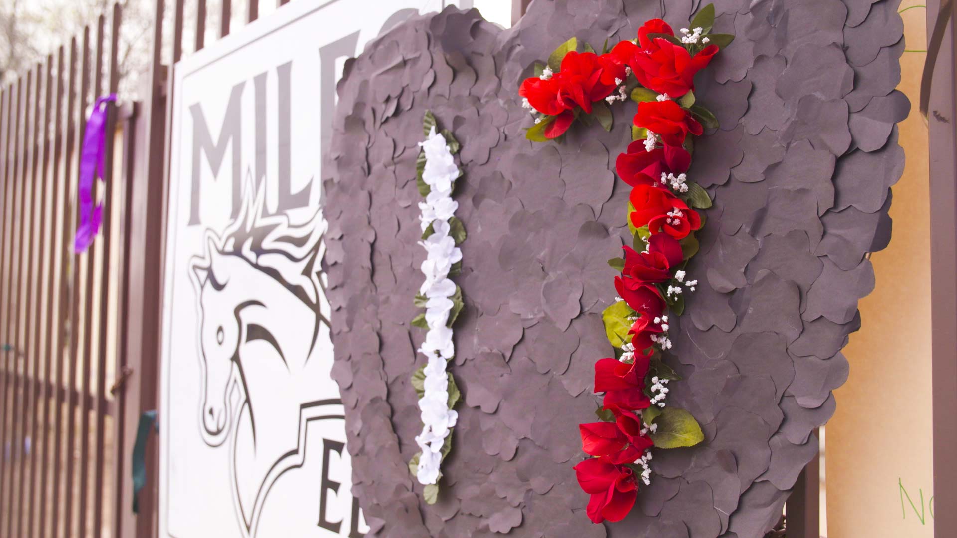 A sign put up March 14 outside the Miles Exploratory Learning Center in Tucson reading "17" in remembrance of the 17 people killed in a Parkland, Florida, school shooting one month before. 