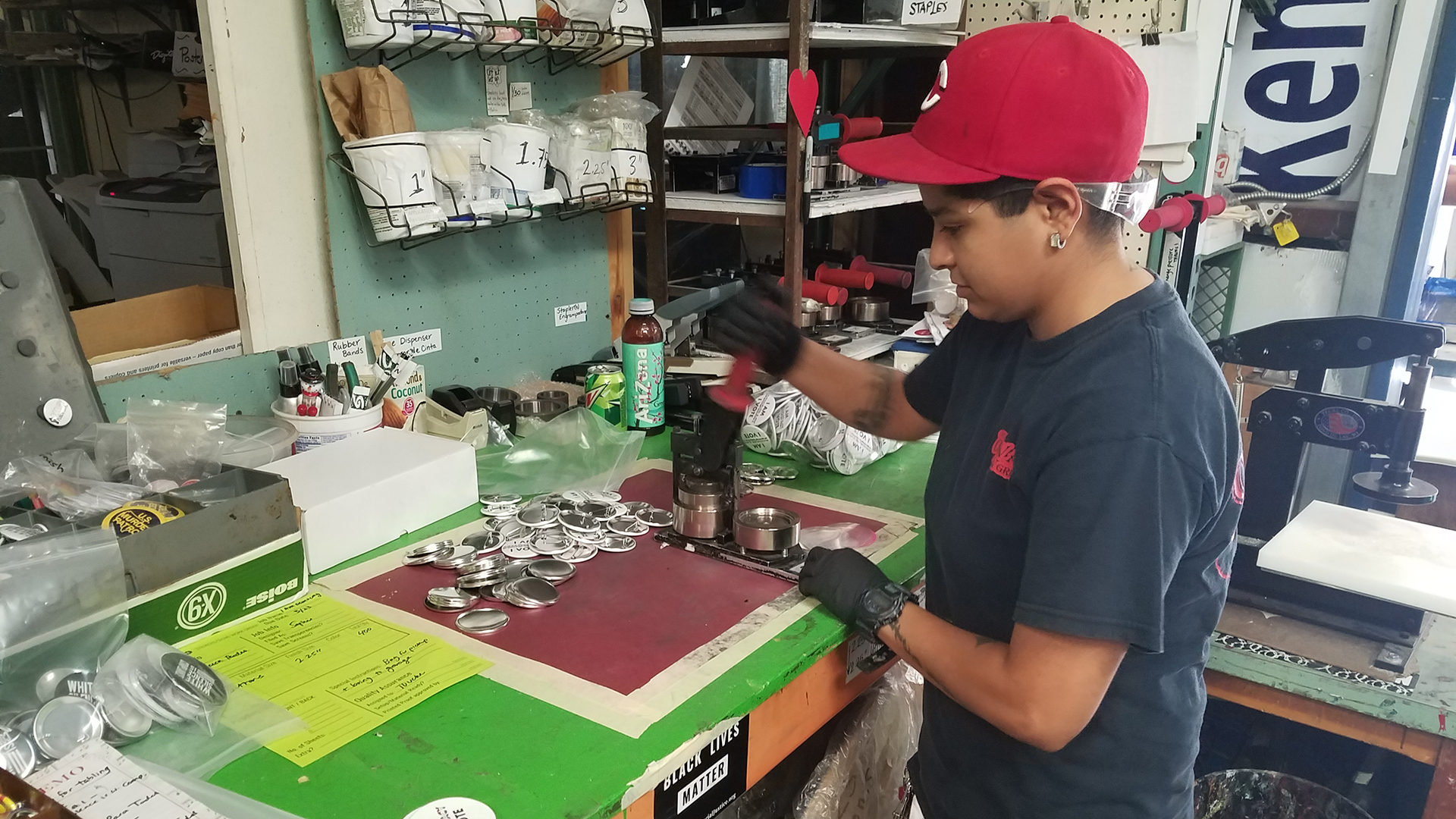 Roxanne Diaz makes buttons that read 'I am Democracy, and I Vote."