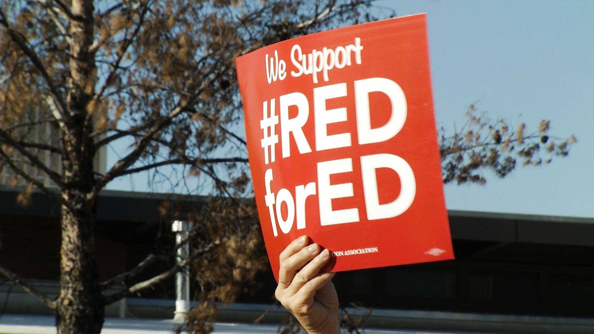 A sign reading #RedforEd, a hashtag promoting a campaign to increase education funding in Arizona.